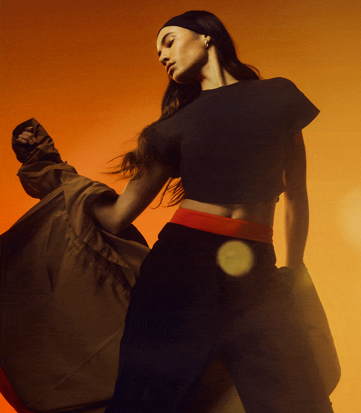 A gif shows a person is holding a flower to their face, a person wearing the Open Back Half-Zip Sweater, and a person wearing the Heavyweight Cotton Mock-Neck T-Shirt and the Cinchable Cuff High-Rise Jogger.