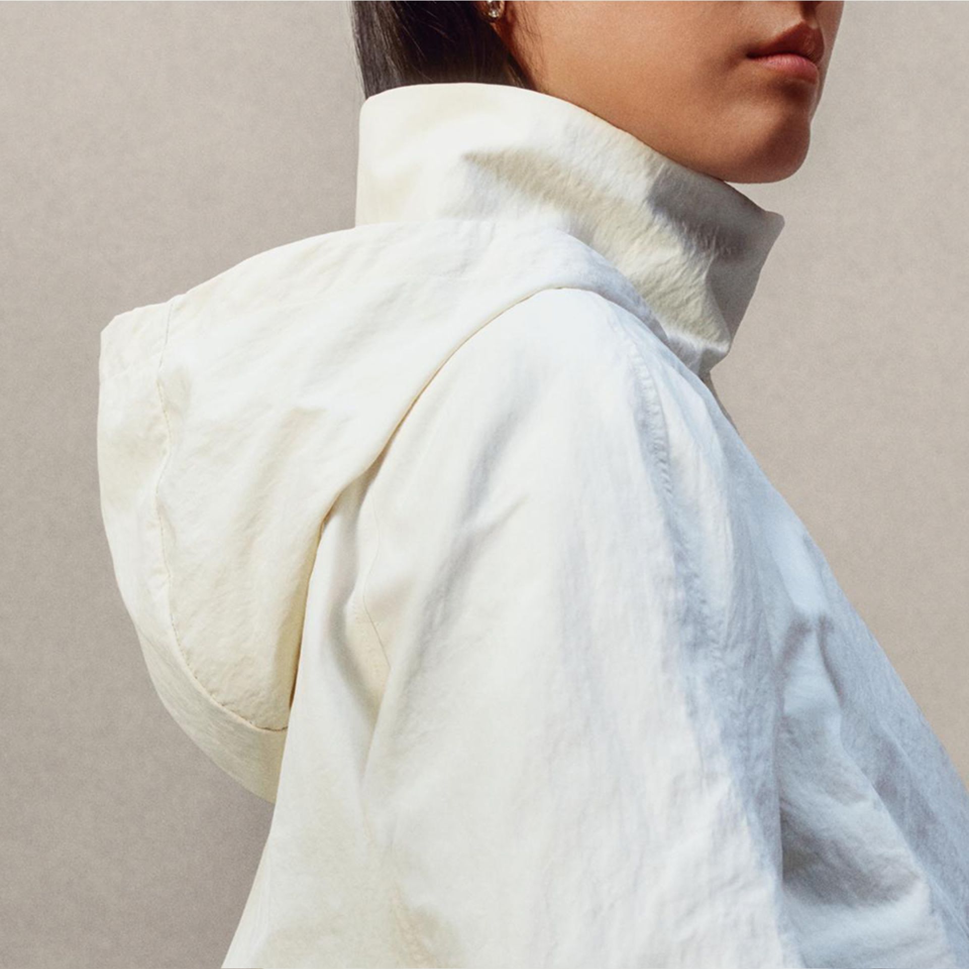 A close-up of a person wearing the Always Effortless Jacket turned to the side.