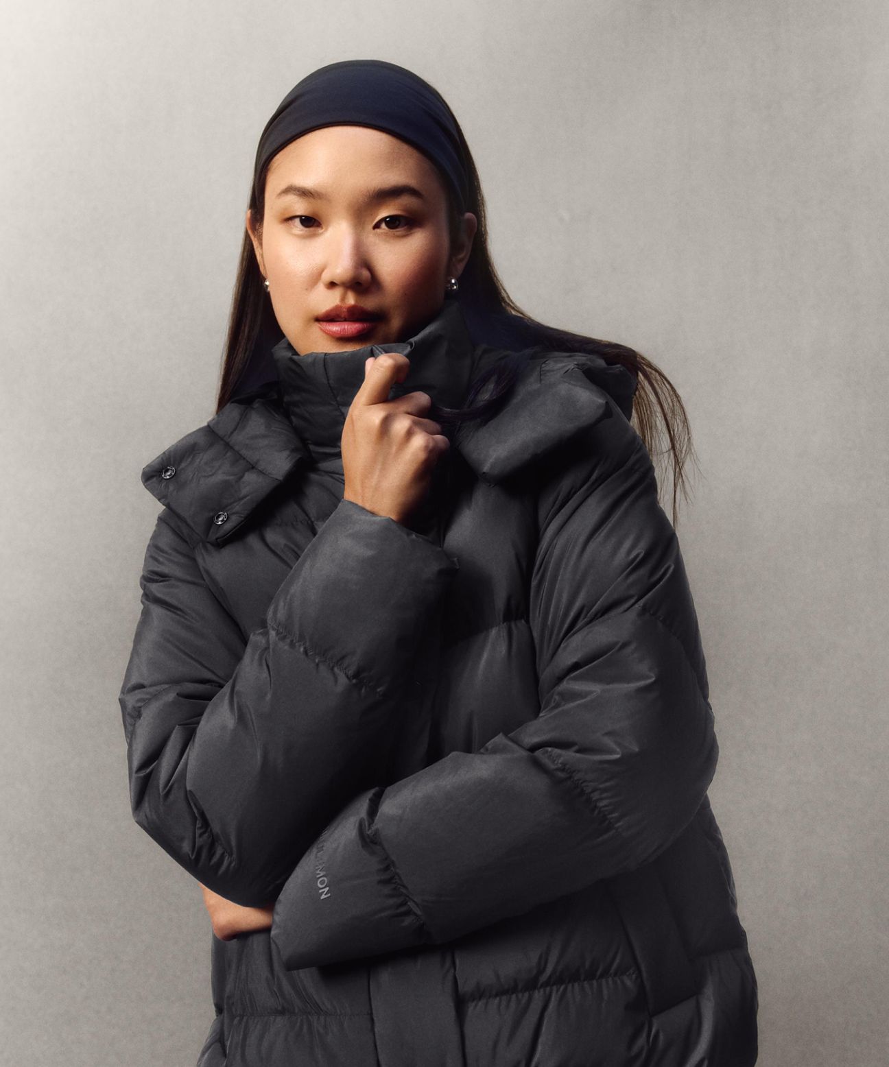 A person wearing the Wunder Puff Jacket while looking at the camera.