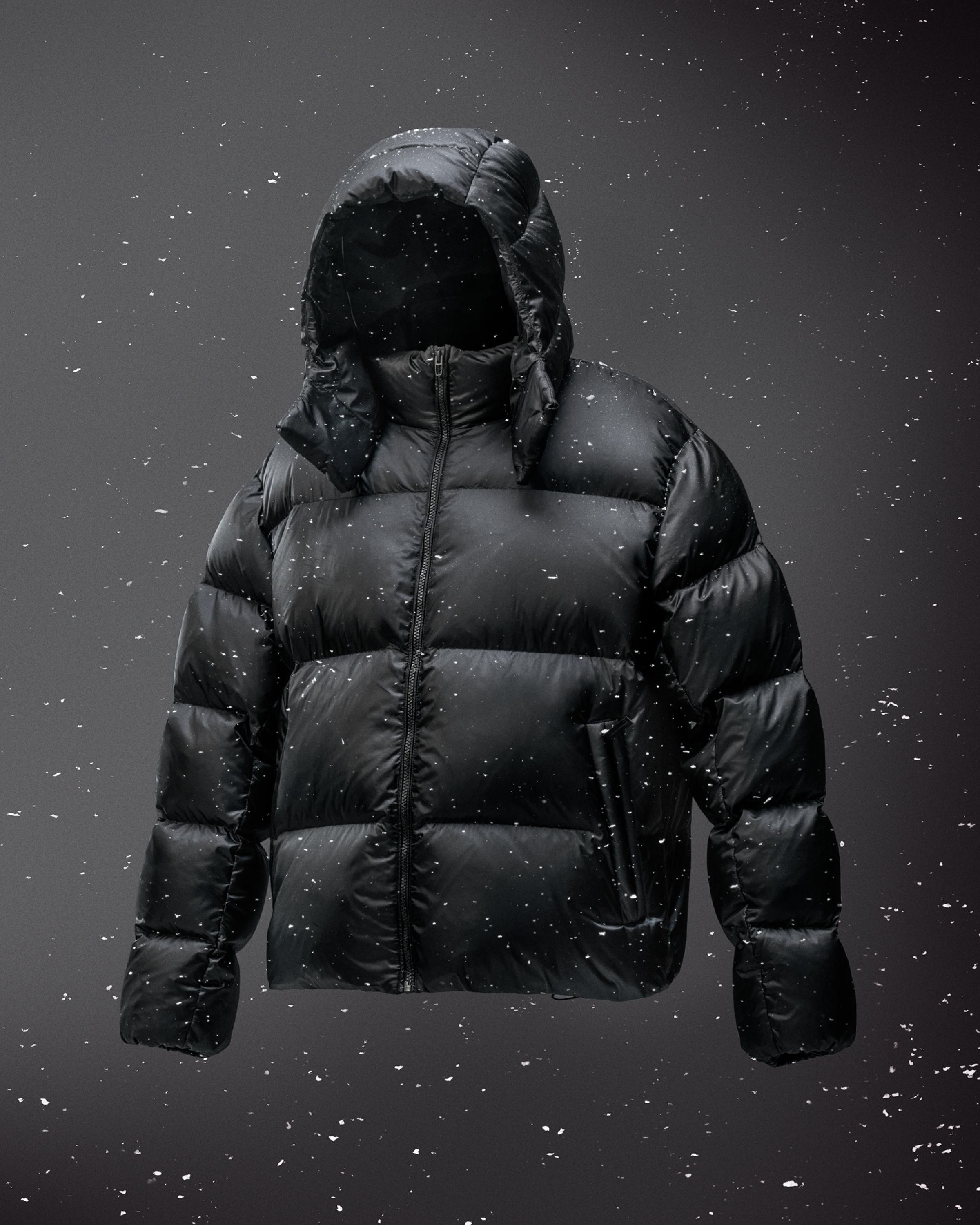 An image of the Always Down Puffer jacket floating with snow swirling around it.