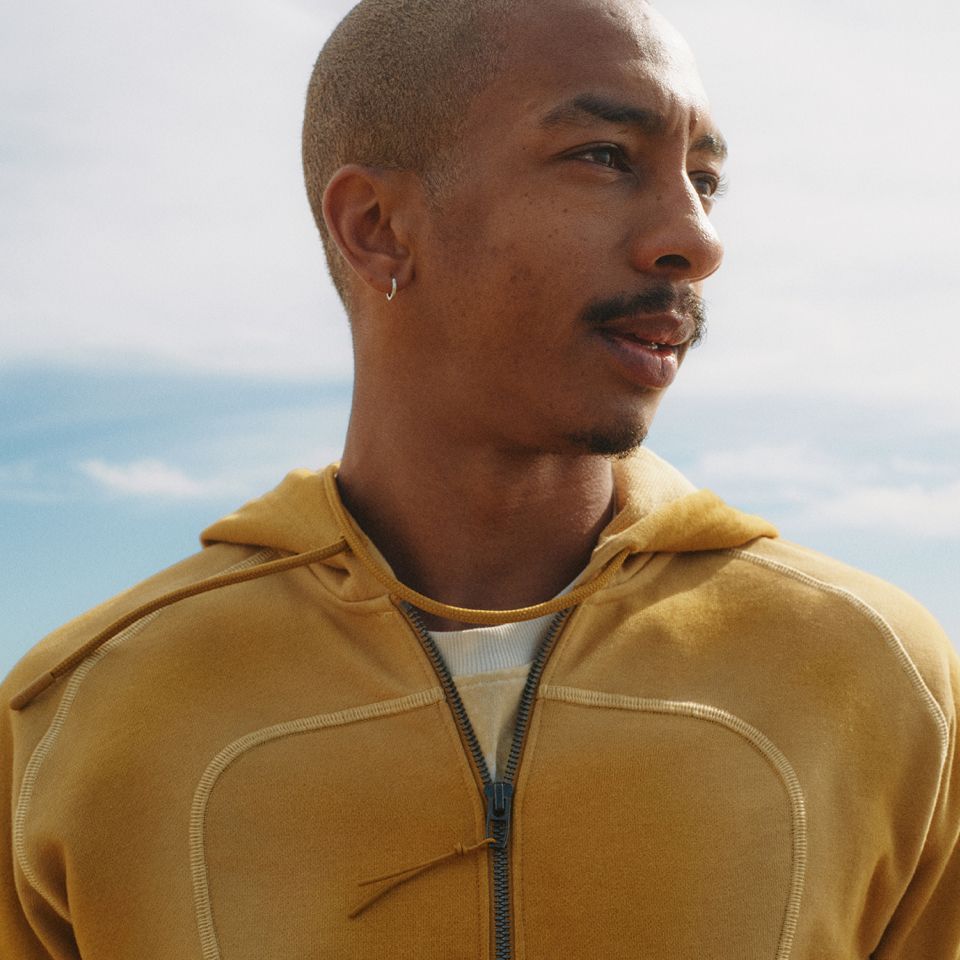 Designer Saul Nash wearing the SLNSH summer 2026 collection.