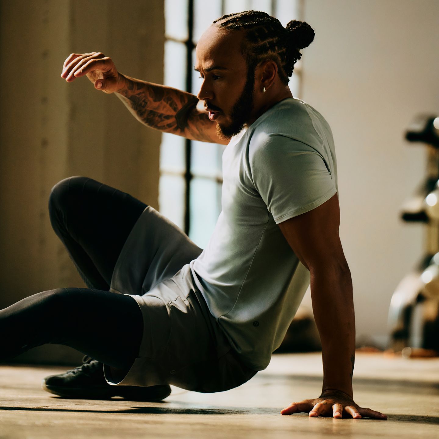Seven-time world champion and lululemon ambassador Lewis Hamilton exercises in lululemon clothing.