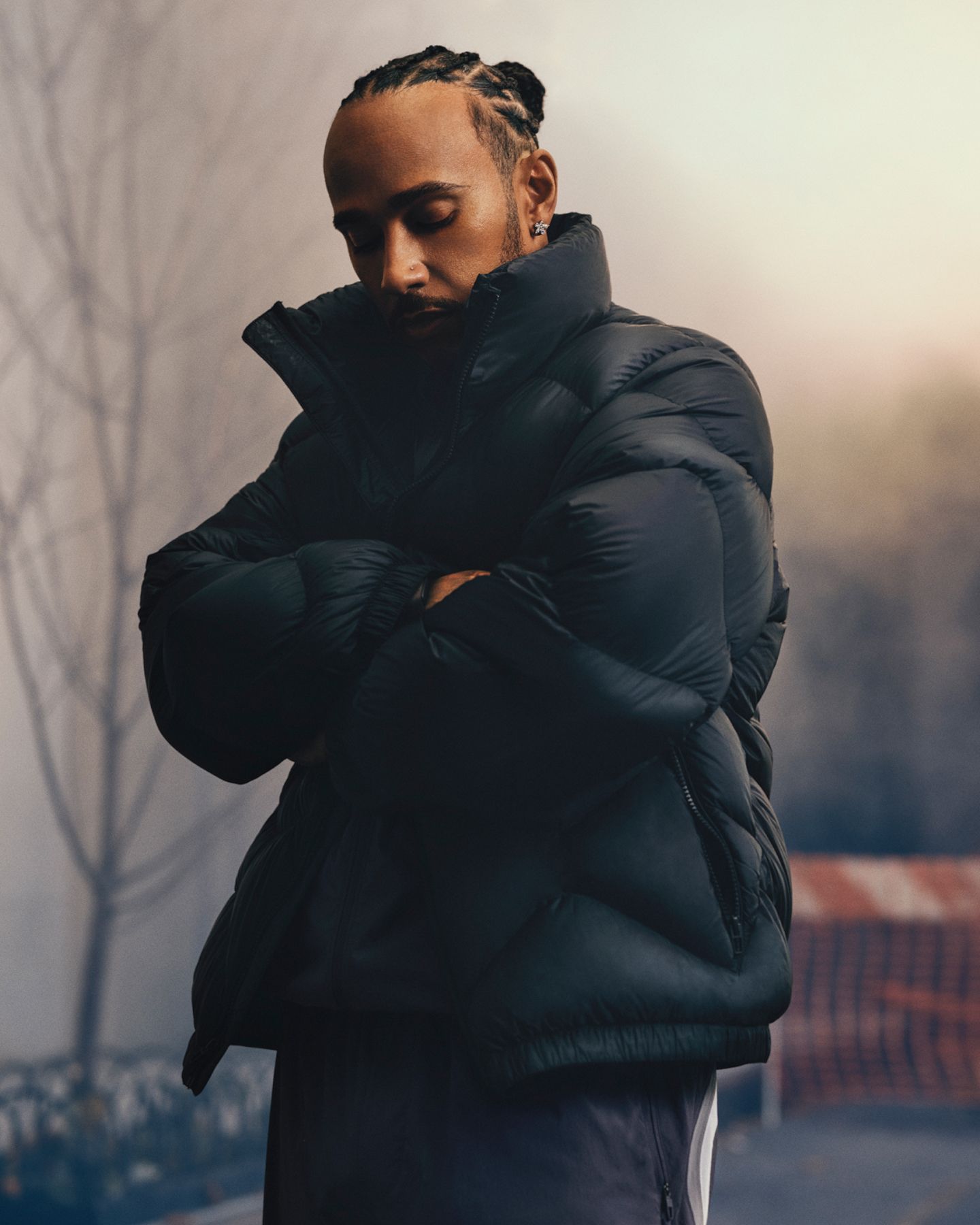 Lewis Hamilton, lululemon Ambassador, in the Featherweight Stand-Neck Quilted Puffer in Black.