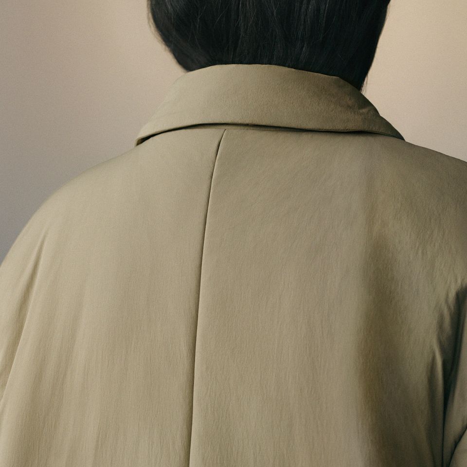 A person wearing the Thermozen™ Insulated Mac Coat in Rumble Crumble.