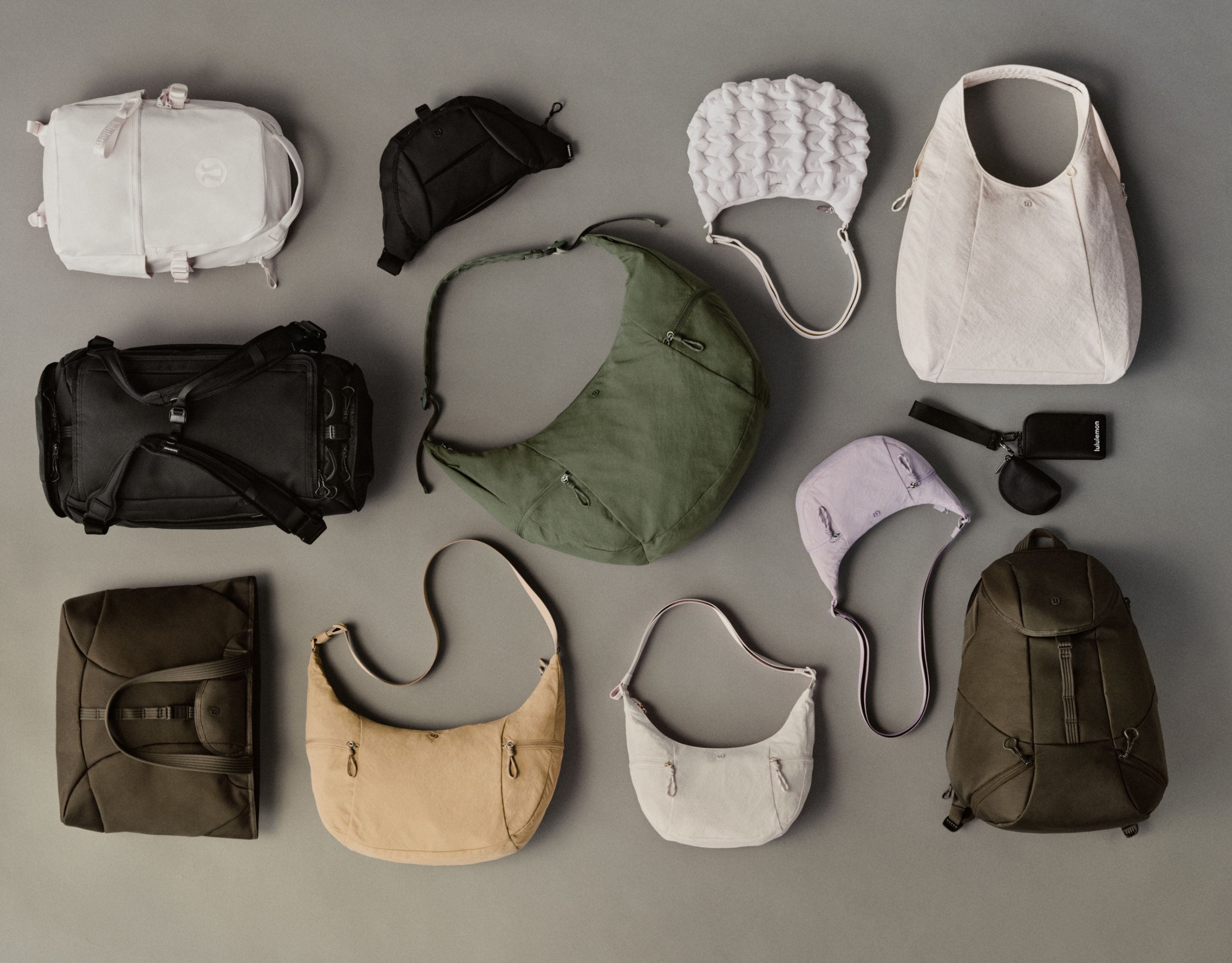 An overhead picture of various different bags in the Fall Bags Collection laying on the ground.