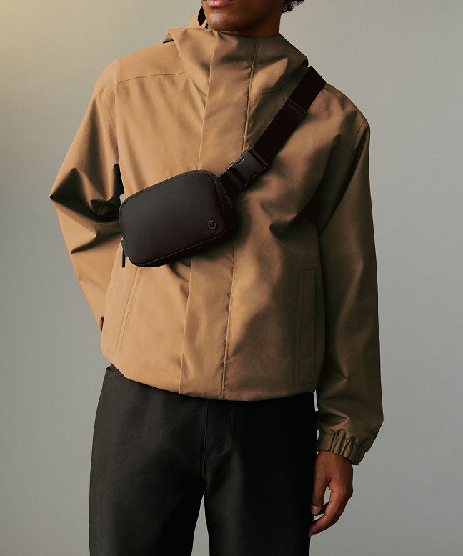 A person stands with the Daily Dispatch bag on their shoulder.