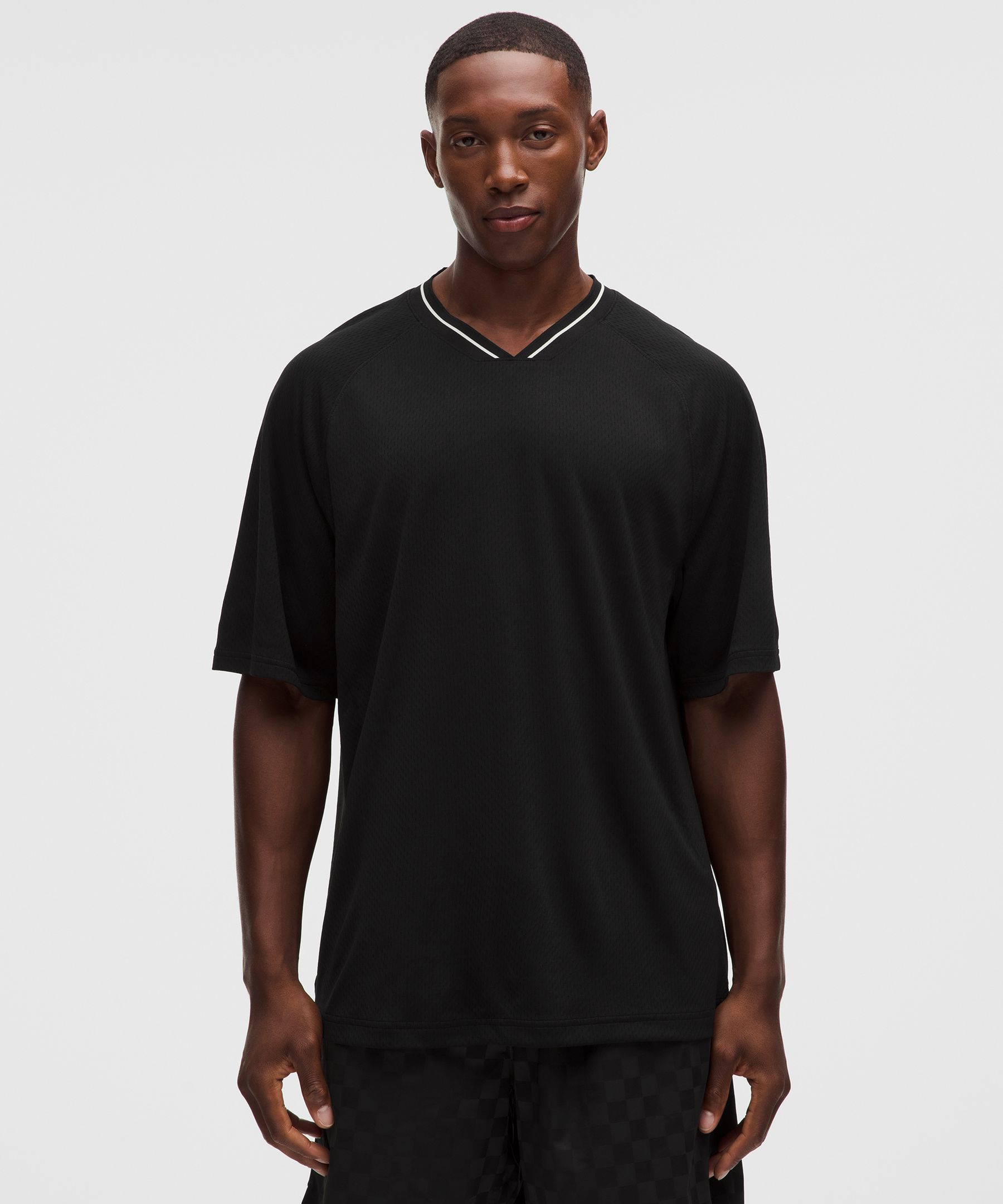 Playera de jersey de manga corta con cuello y ajuste relajado