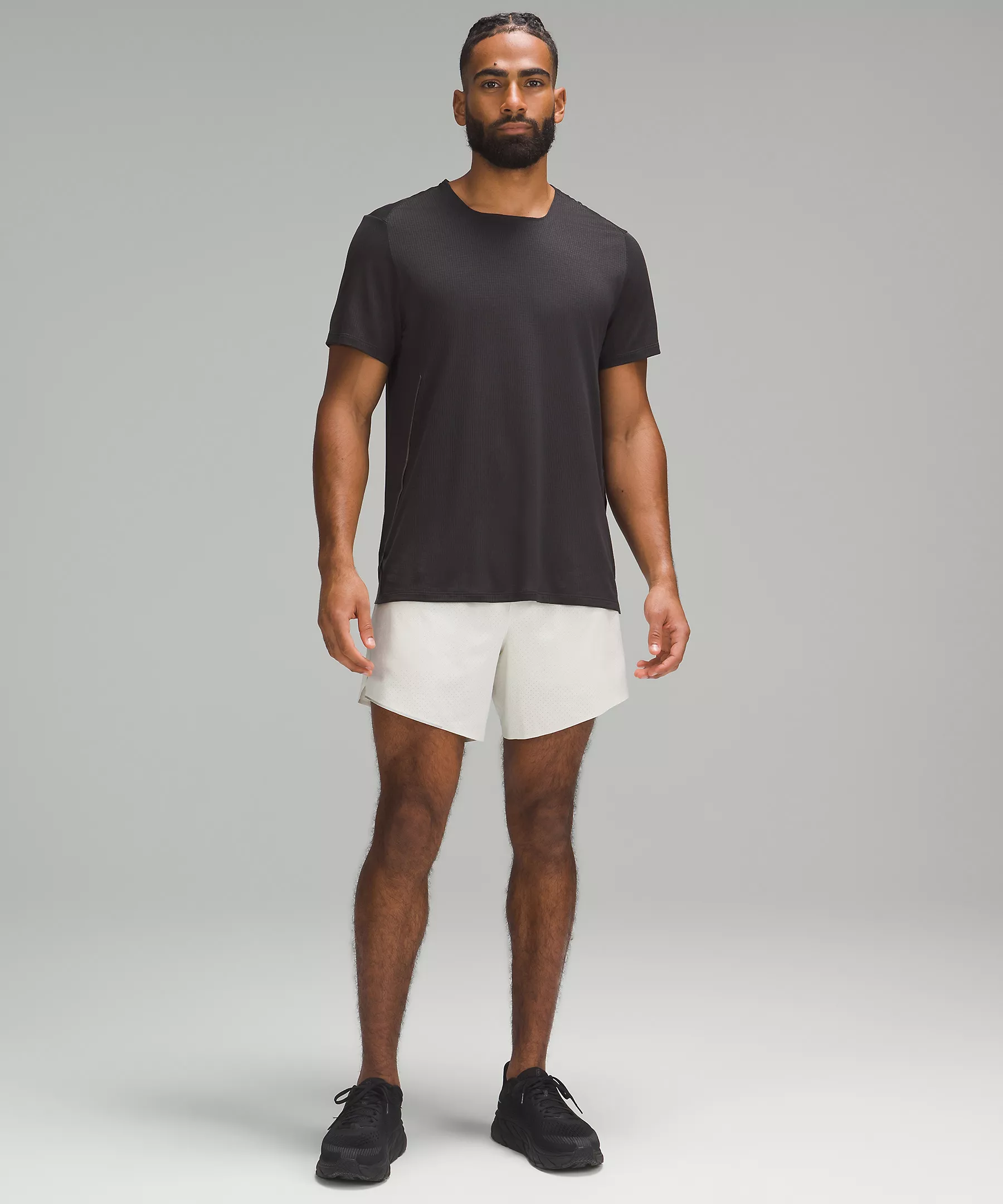 A photo of a man wearing the white lulu lemon sport shorts
