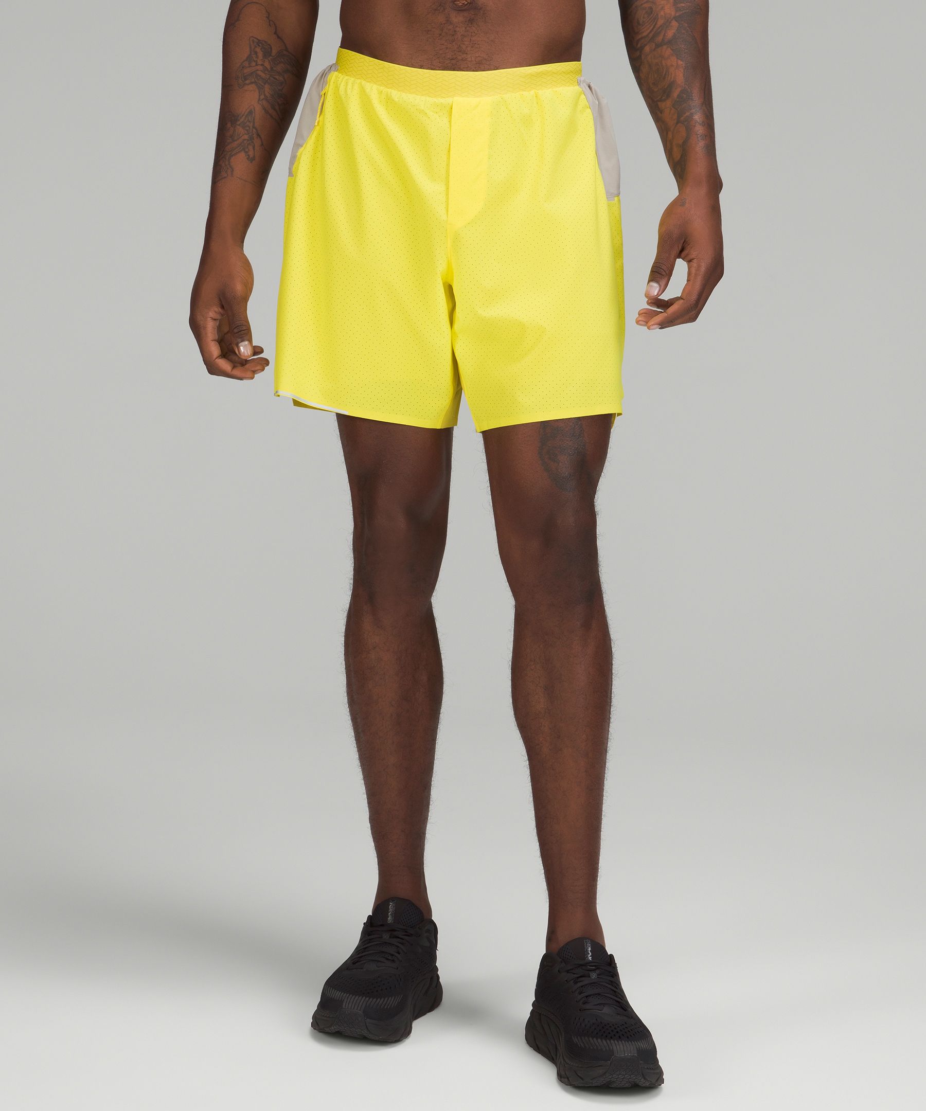 Yellow And Black Men's Running Shorts at best price in Tiruvallur