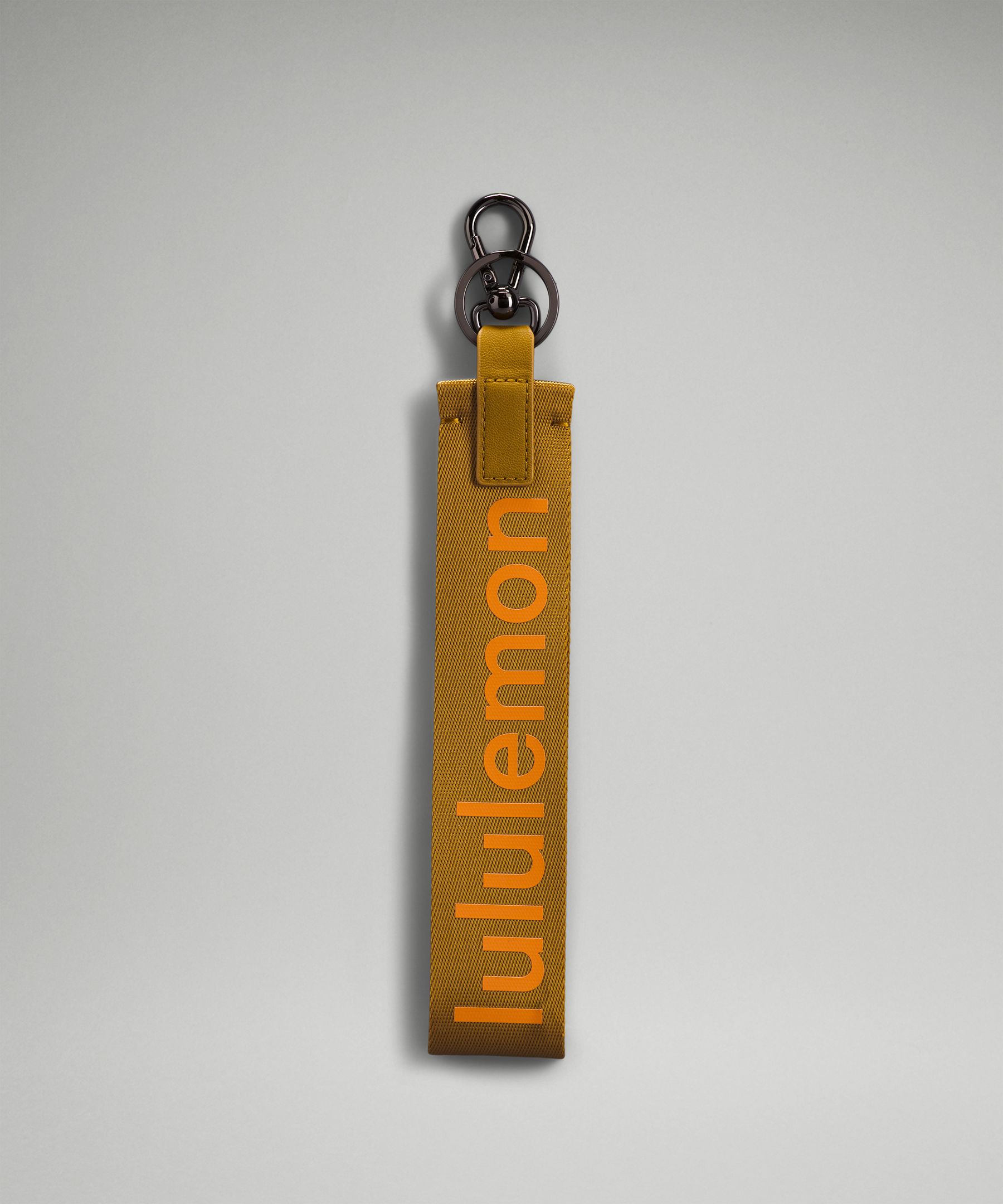 Lululemon Never Lost Keychain In Gold Spice/clementine