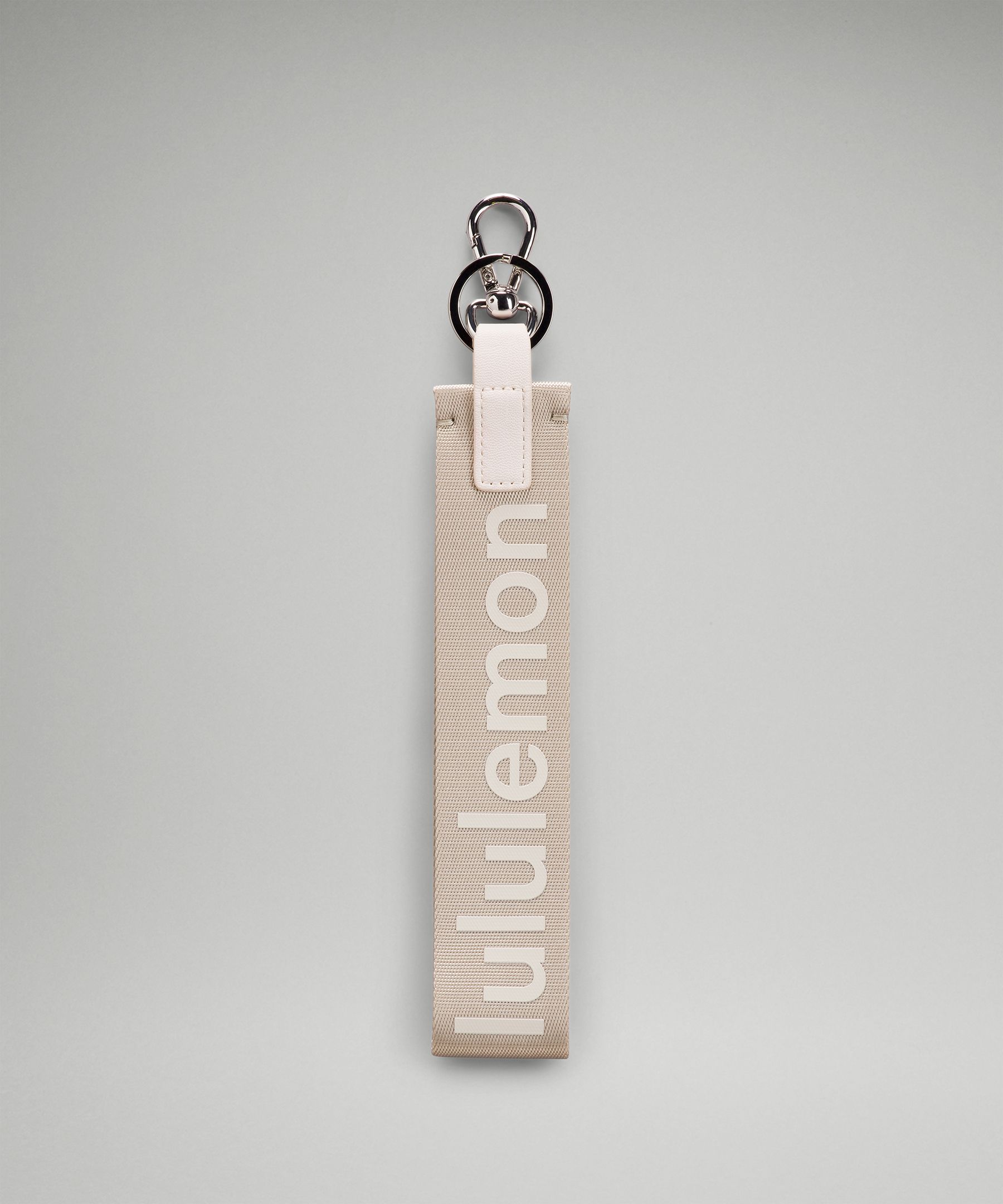 Lululemon Never Lost Keychain In Raw Linen/white Opal