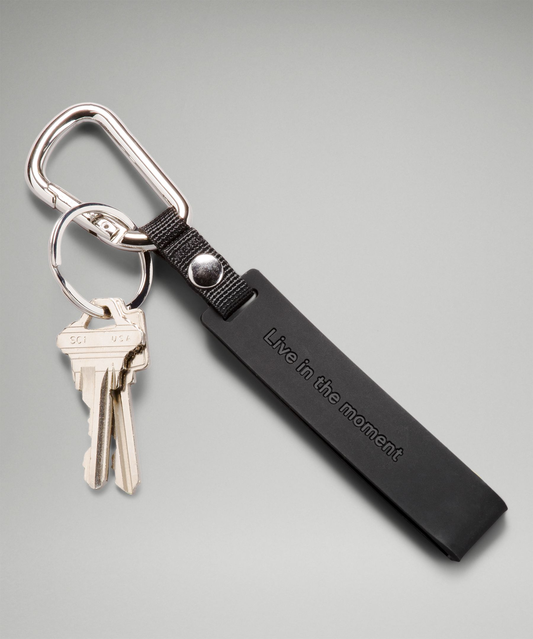 Shop Lululemon Silicone Keychain In Black/silver