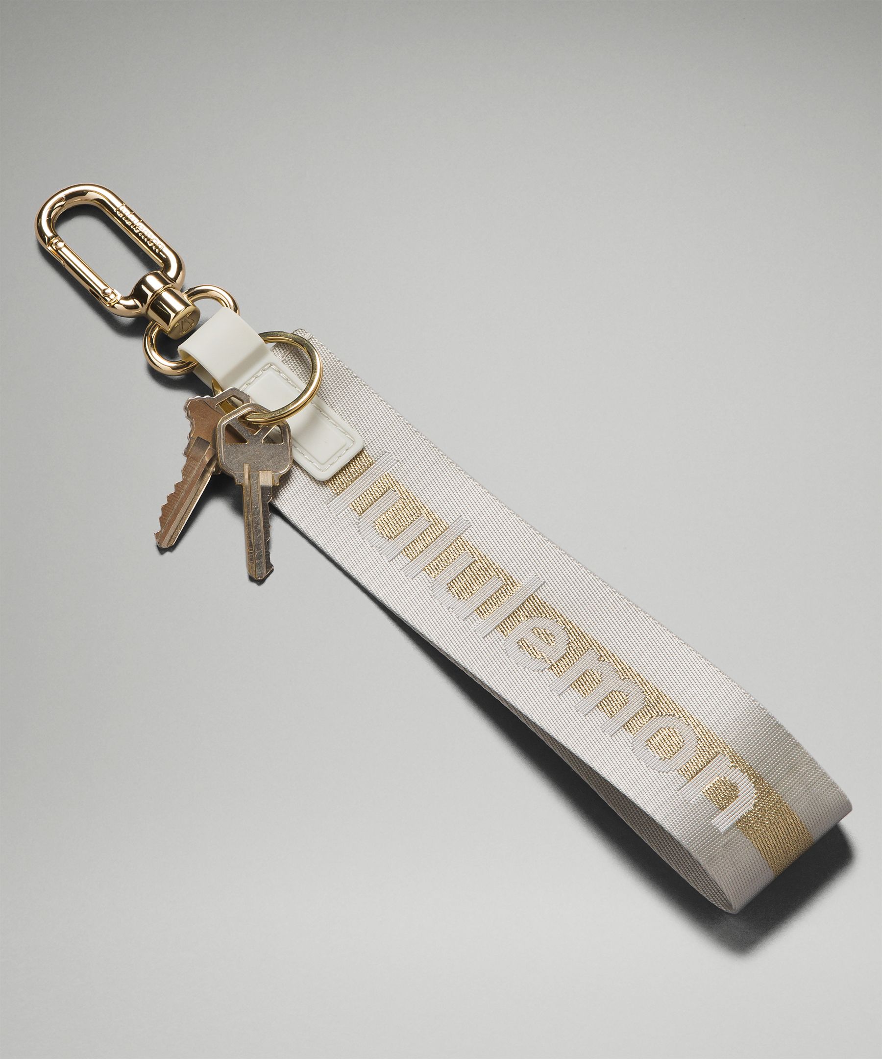 Lululemon Never Lost Keychain - Grey, Gold Keychain