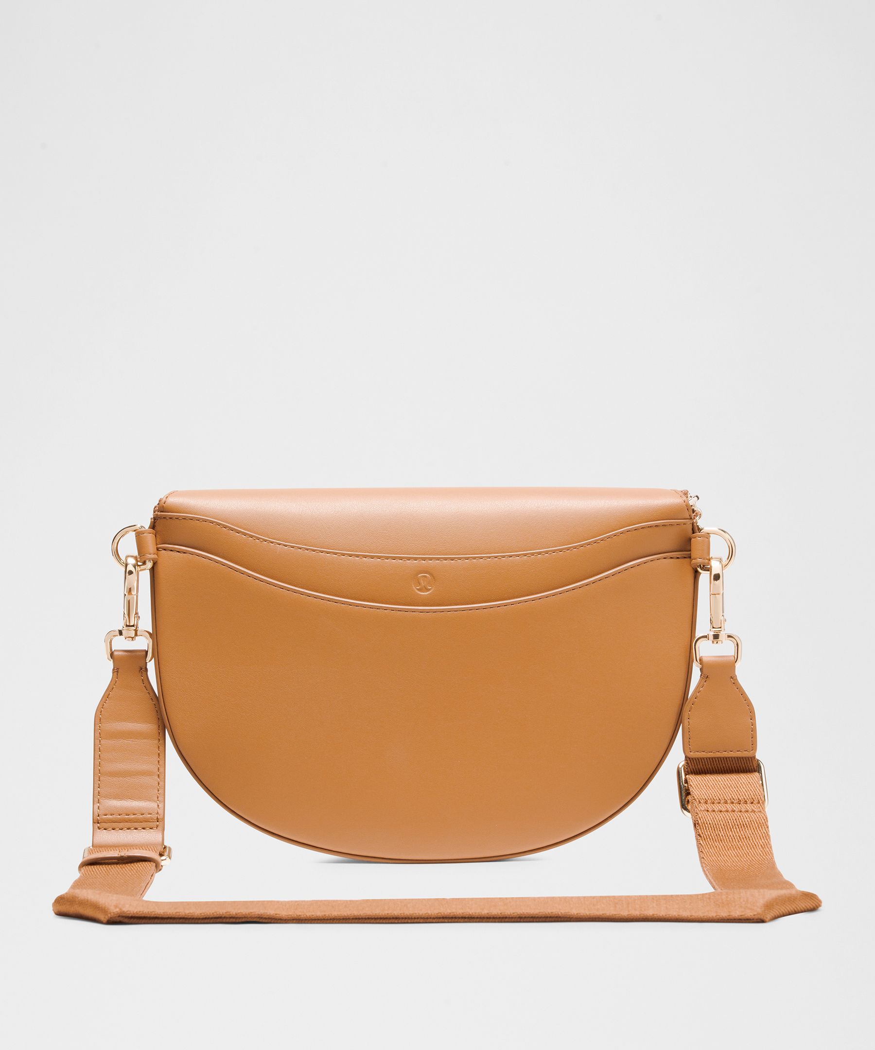 LULULEMON LULULEMON - LEATHER ALTERNATIVE SADDLE CROSSBODY BAG 2L - ORANGE/CHESTNUT BROWN/GOLD 