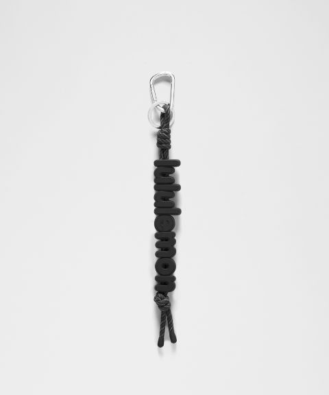 Брелок Lululemon Silicone Wordmark Keychain, цвет: Чёрный / Серебряный