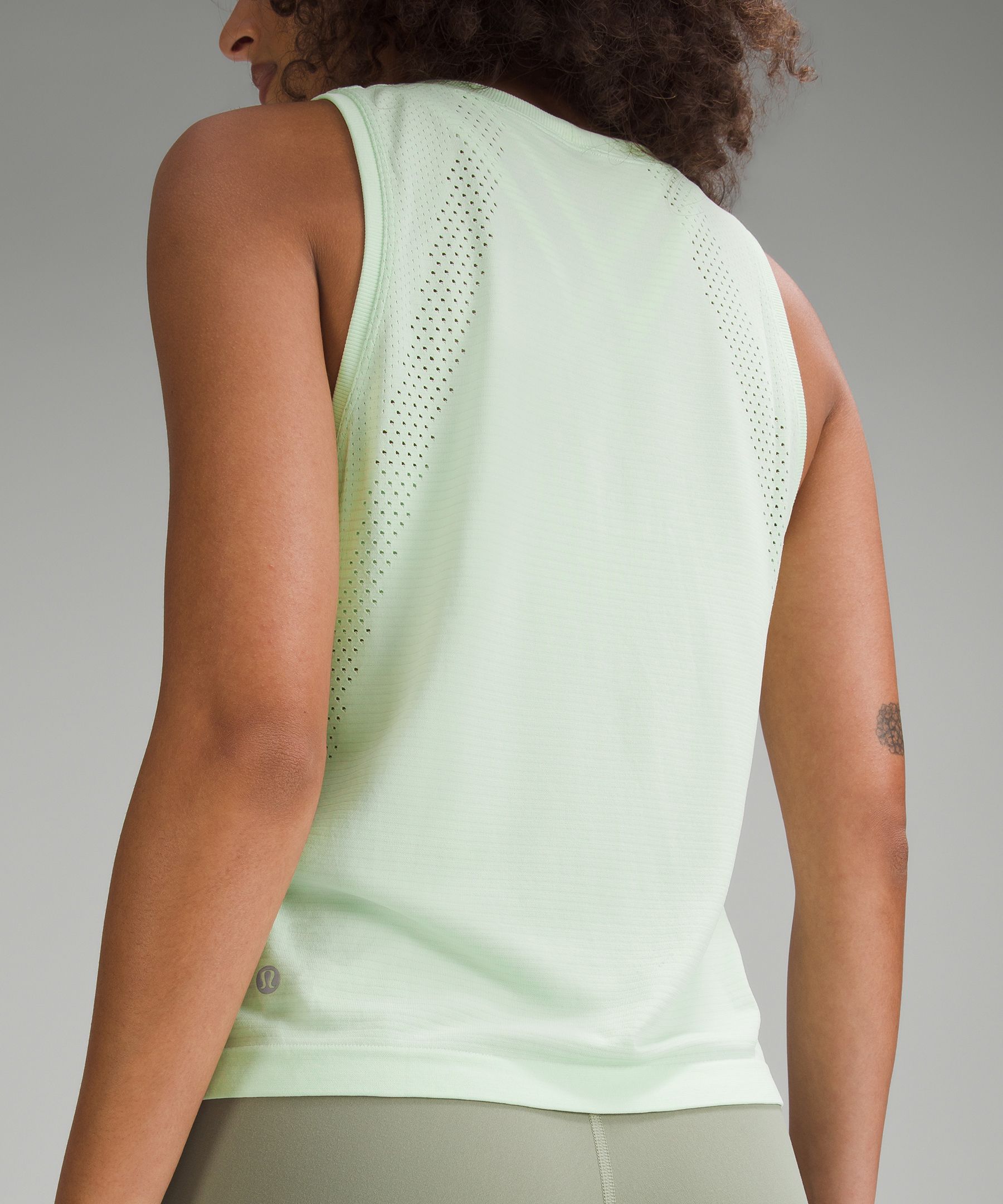 Lululemon Train to Be Tank Top in Lip Gloss worn by Stephanie