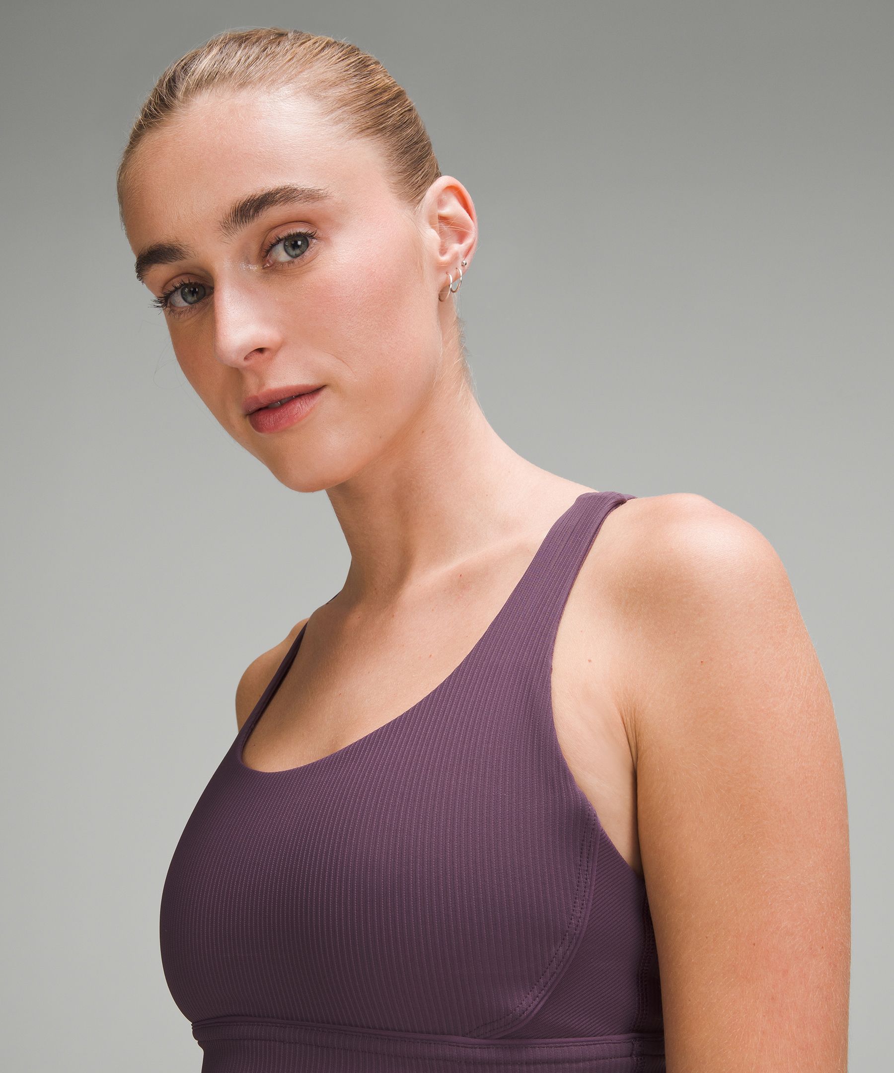Help me pick a Lululemon sports bra to wear with my new running shorts!  Left Lavender Dusk Energy Long Line Bra Right Violet Viola Ebb to Street Bra.  Shorts are Adidas and