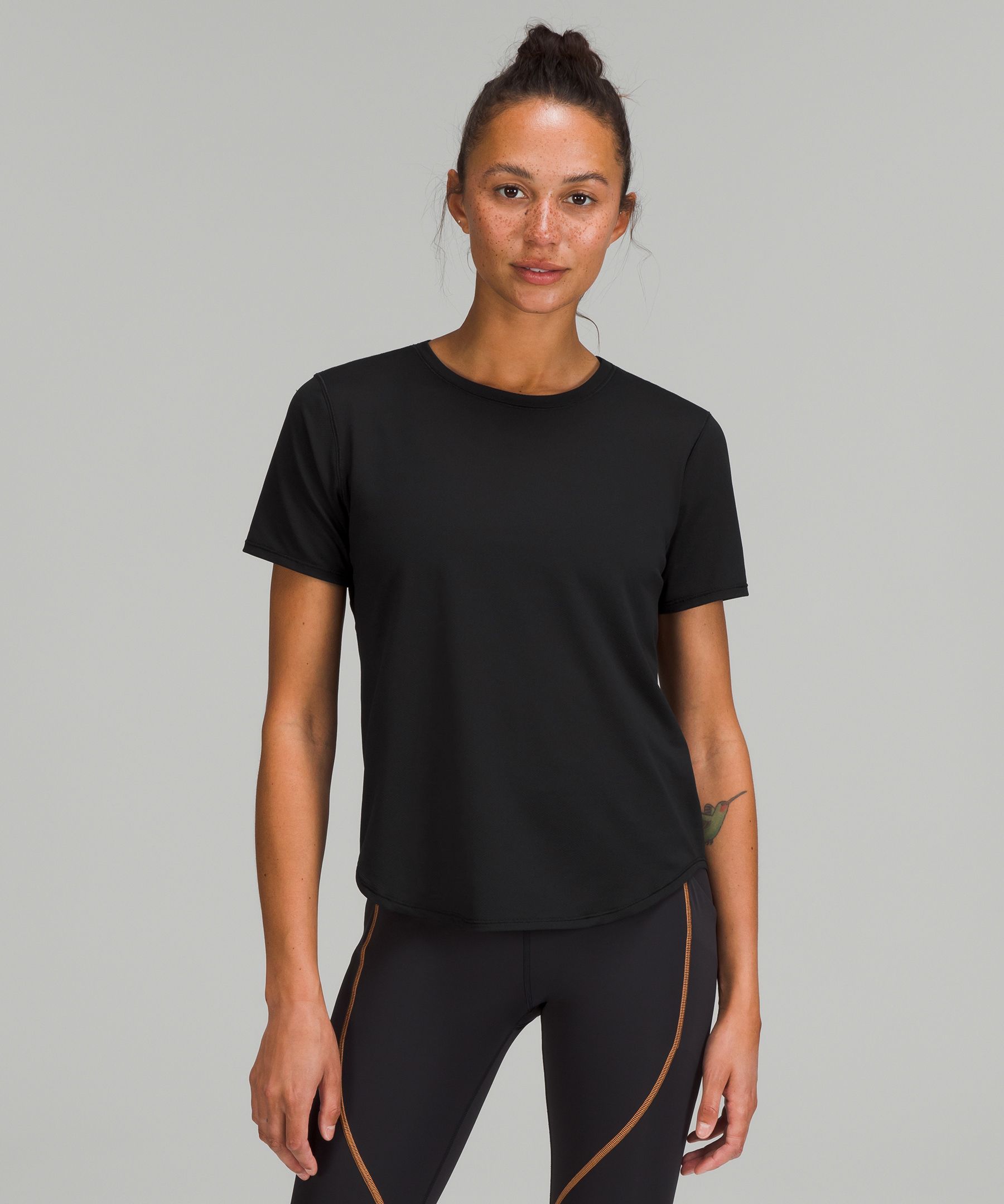 Buy FITKIN Women Black Solid High Neck Training T-Shirt at