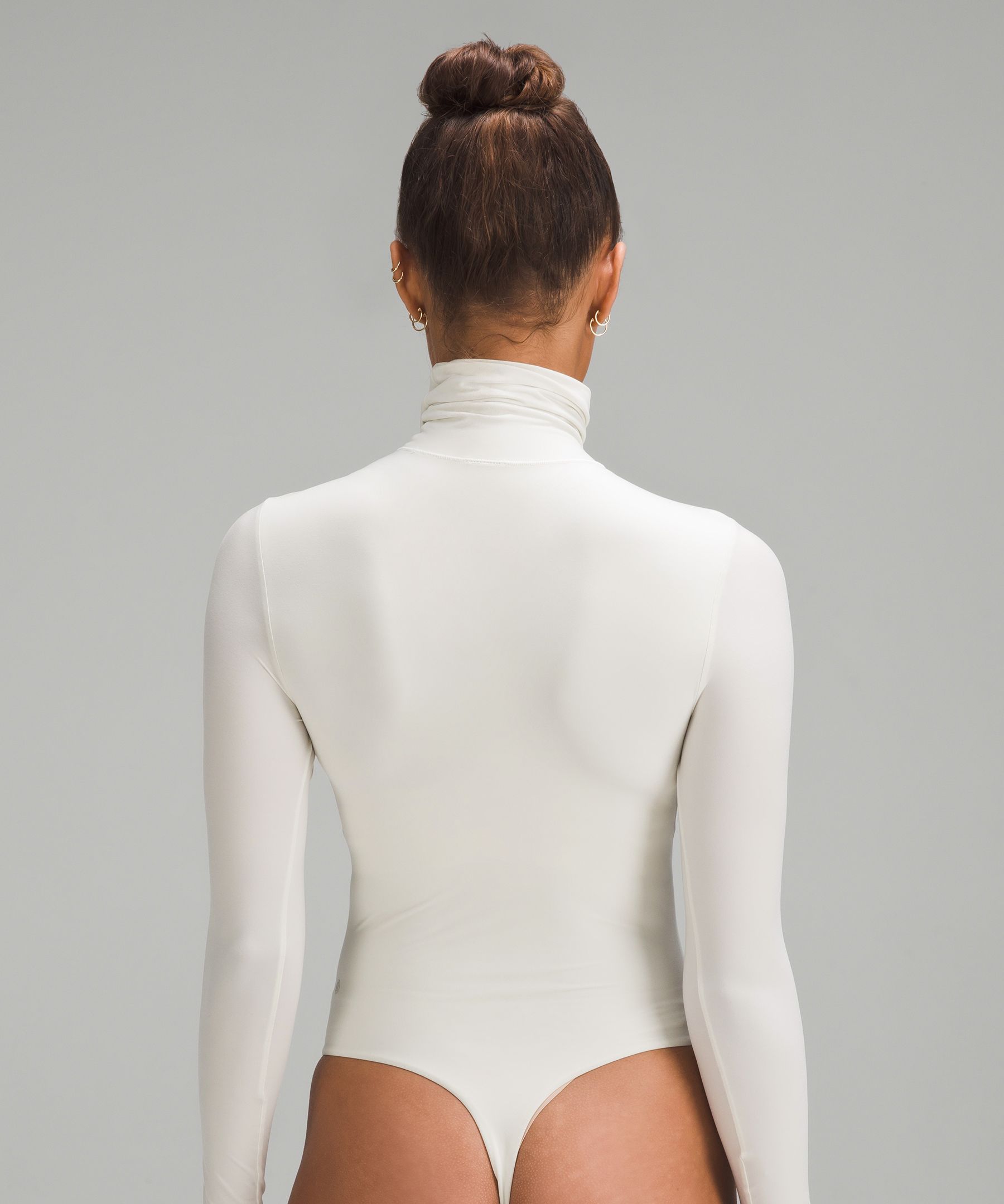 Luxurious long sleeve turtleneck bodysuit made from Italian yarn