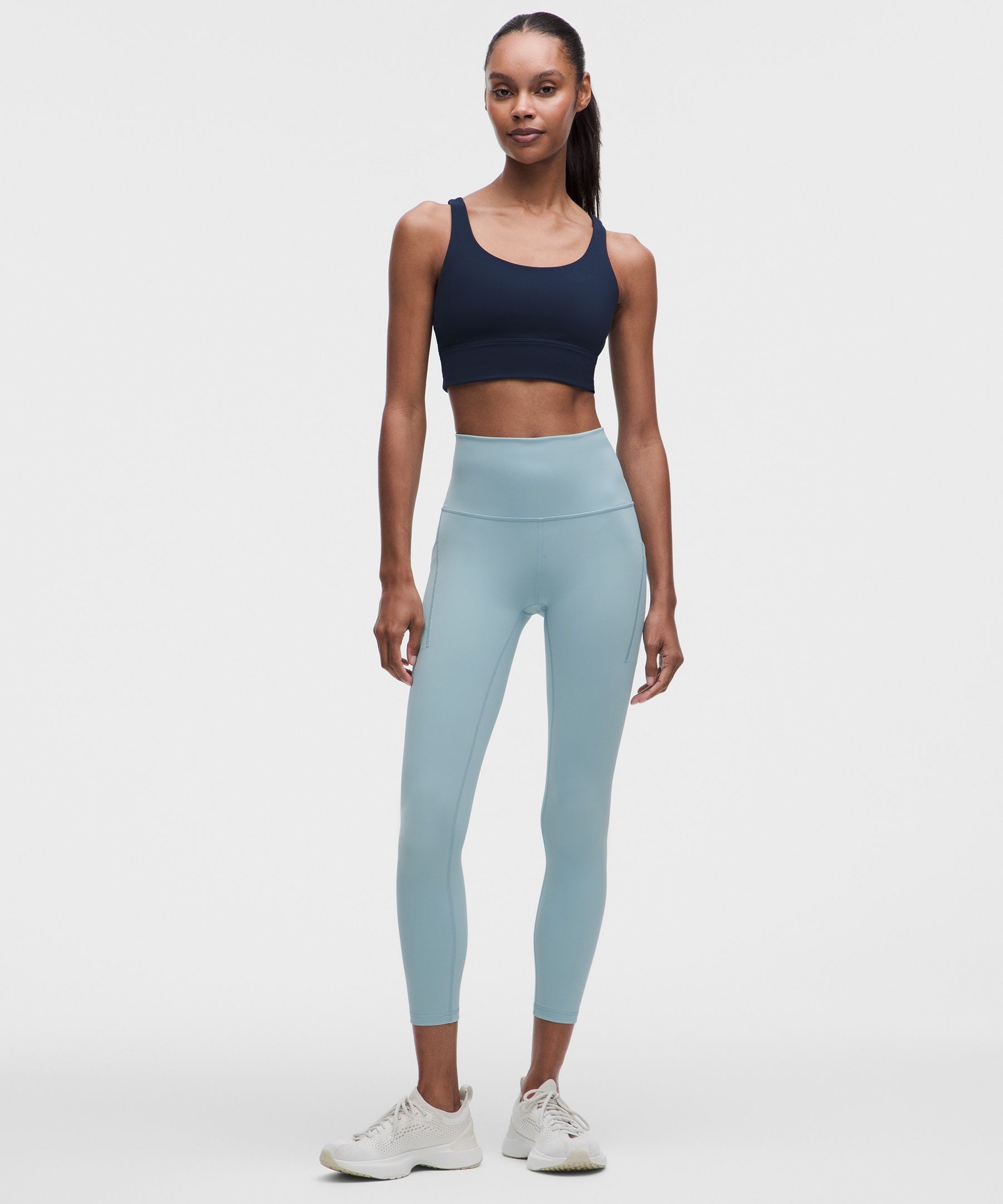 Leggings Wunder Train de tiro alto y con bolsillos 25"