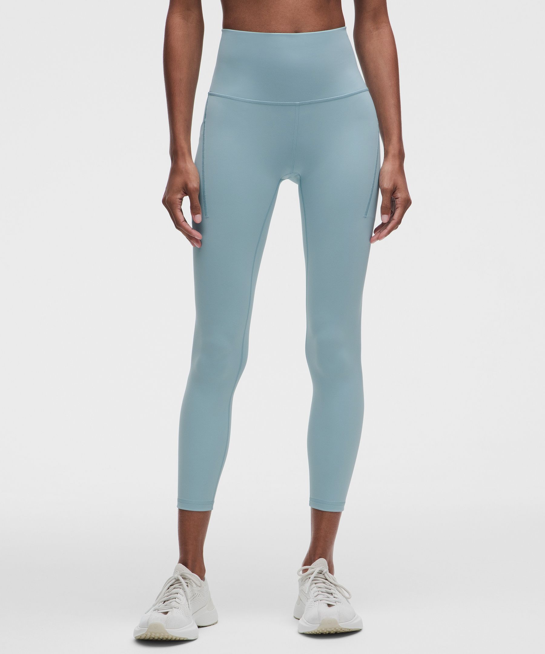 Leggings Wunder Train de tiro alto y con bolsillos 25"