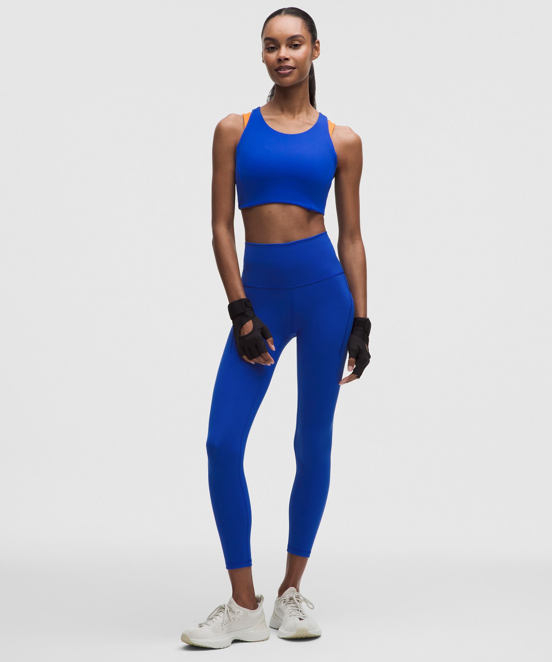 Leggings Wunder Train de tiro alto y con bolsillos 25"