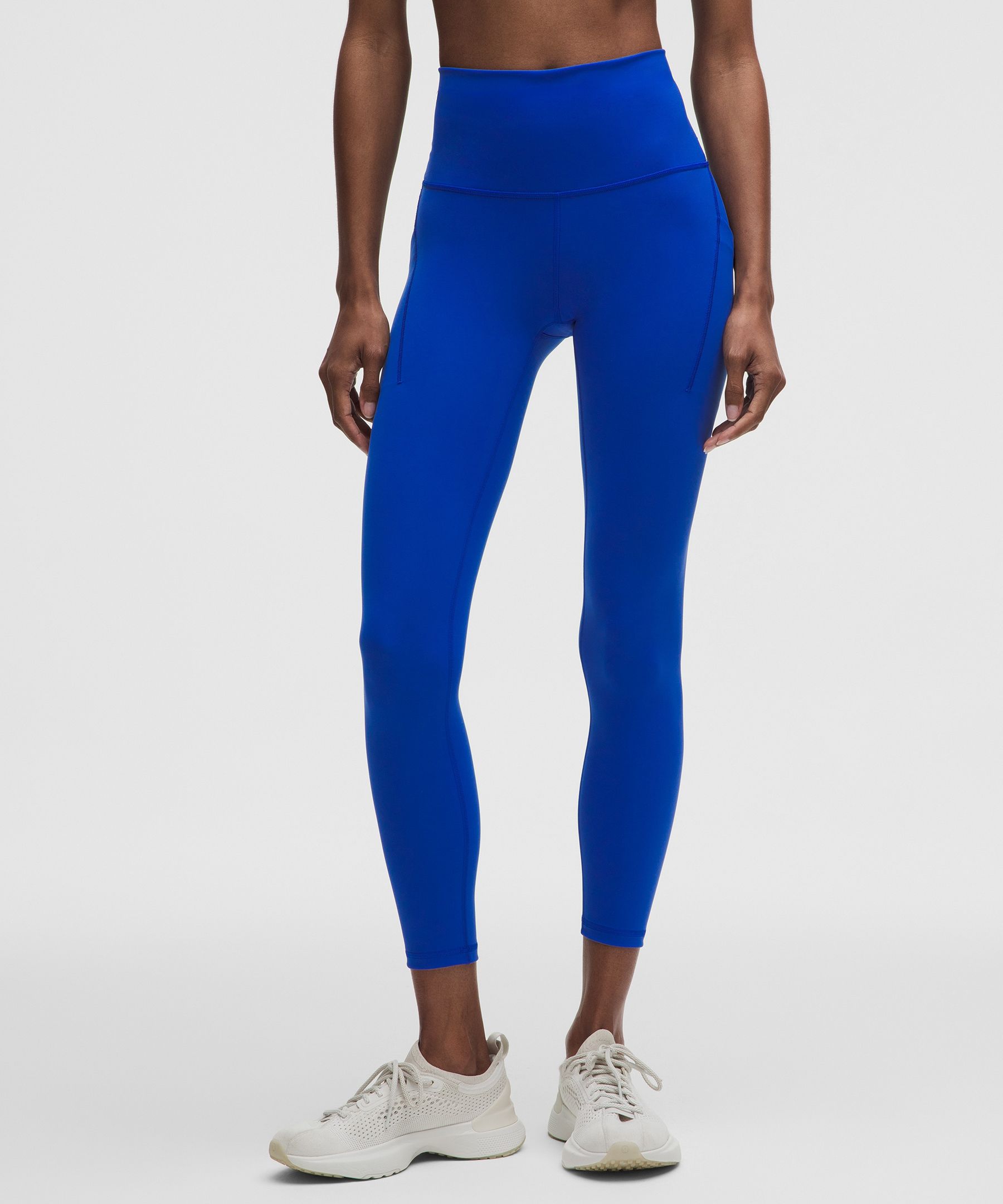 Leggings Wunder Train de tiro alto y con bolsillos 25"