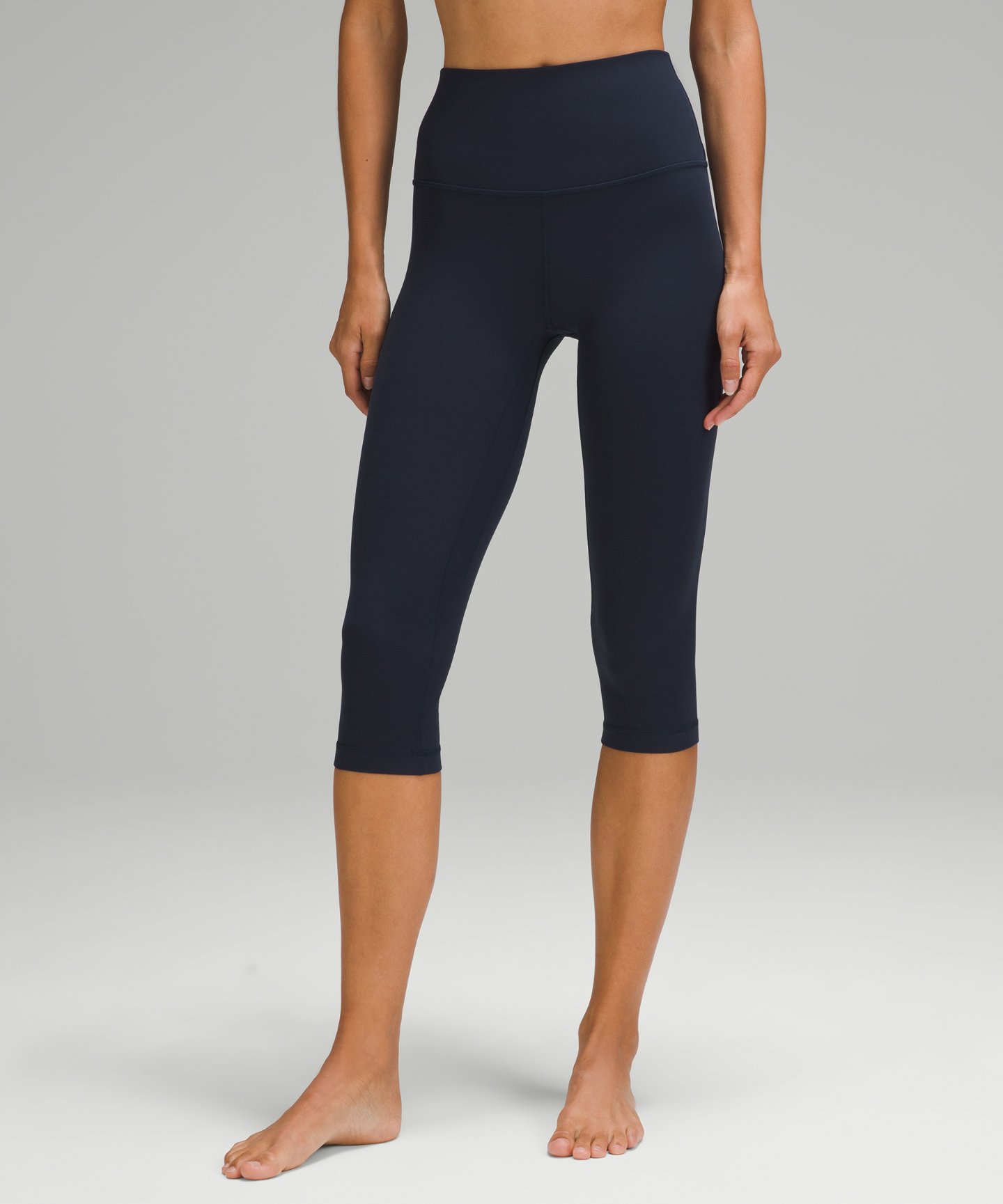 Woman wearing lululemon Align high-rise 17-inch cropped leggings in True Navy — photo 1 of 1