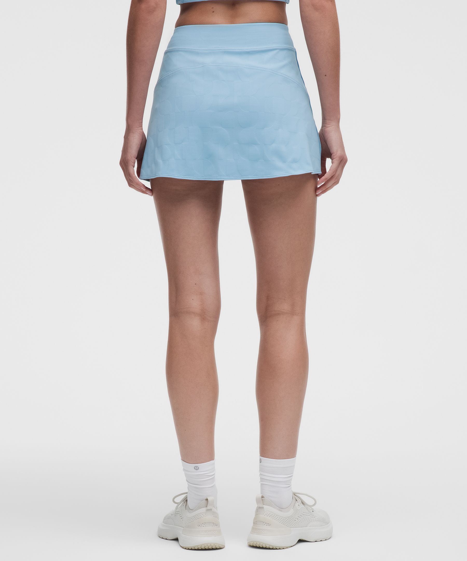 Mini-Tennisrock mit hohem Bund *Jacquard