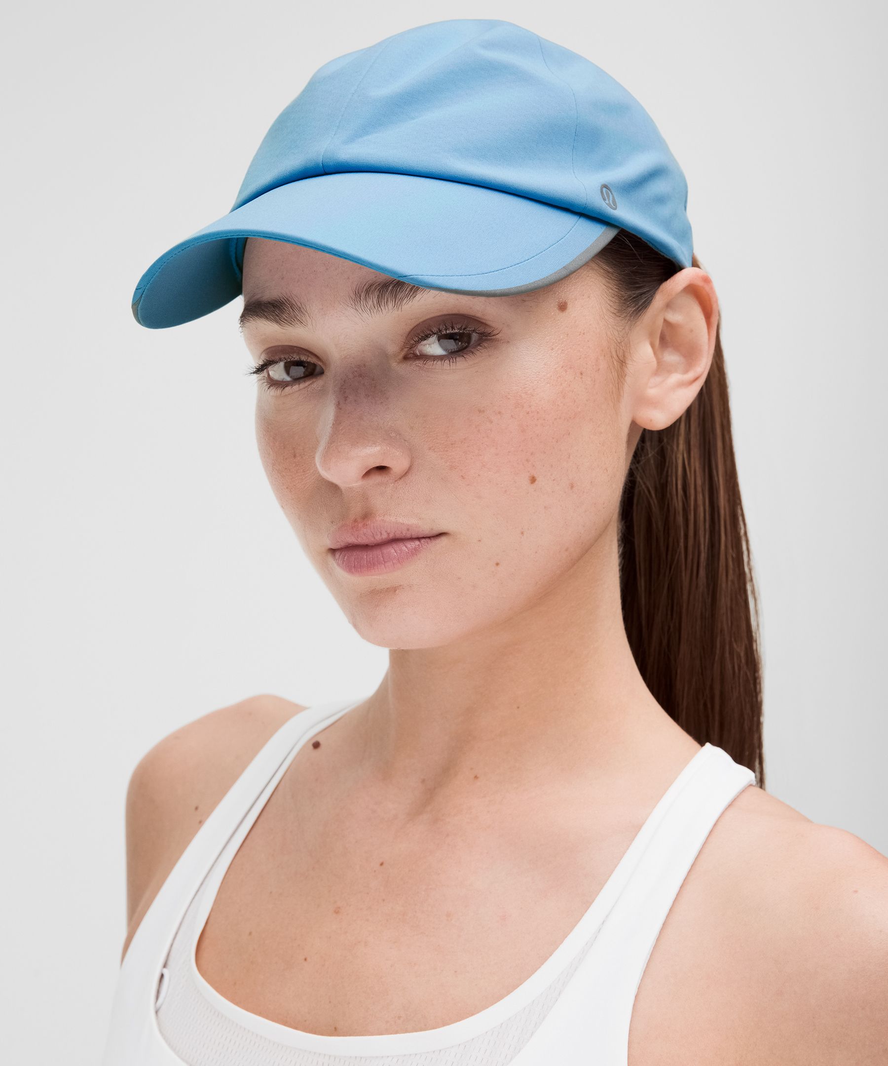 Casquette de running Fast and Free pour femmes avec queue de cheval