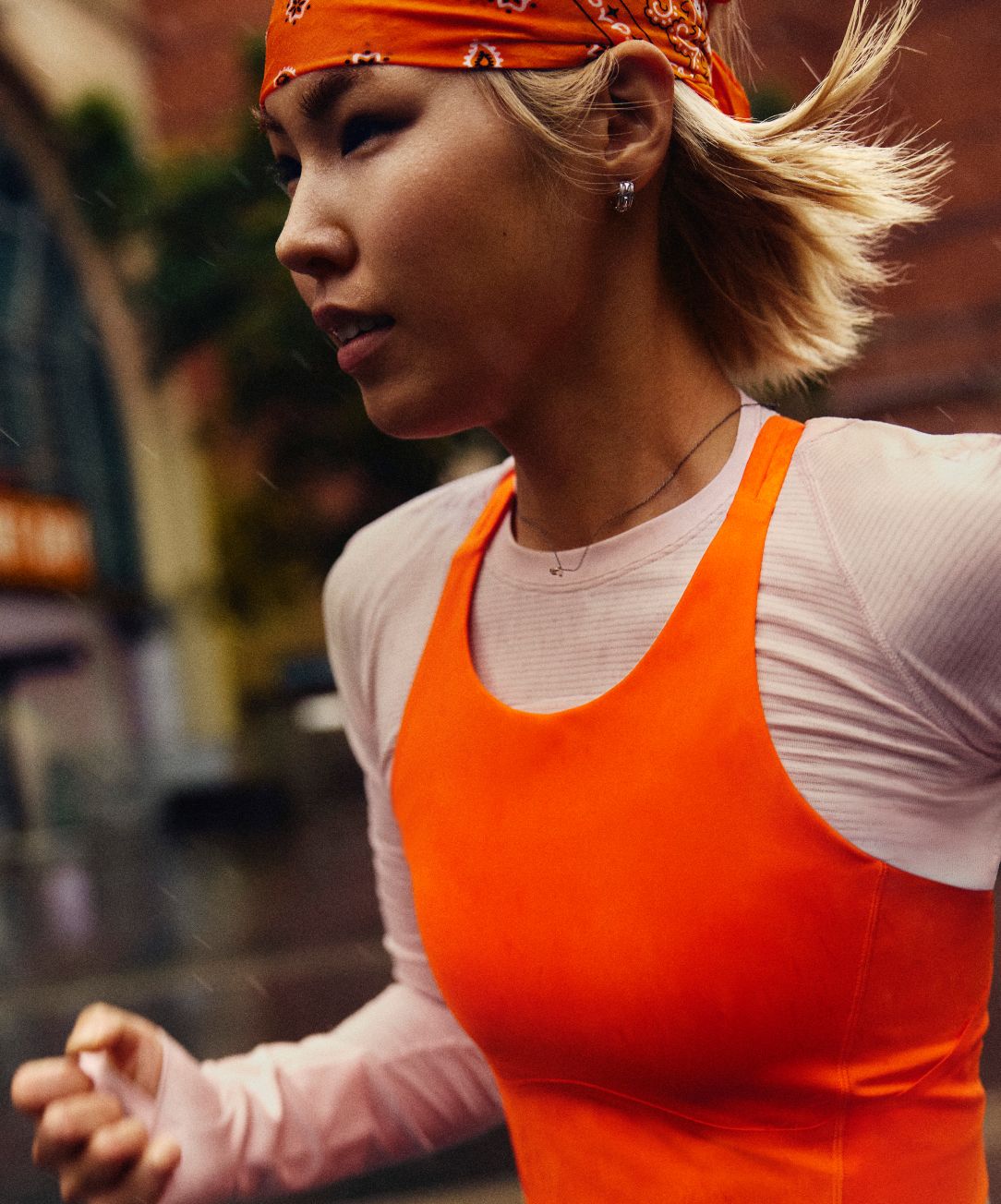 A person wears the lululemon Swiftly Tech Long-Sleeve Shirt with the Fast and Free Tank on top. 