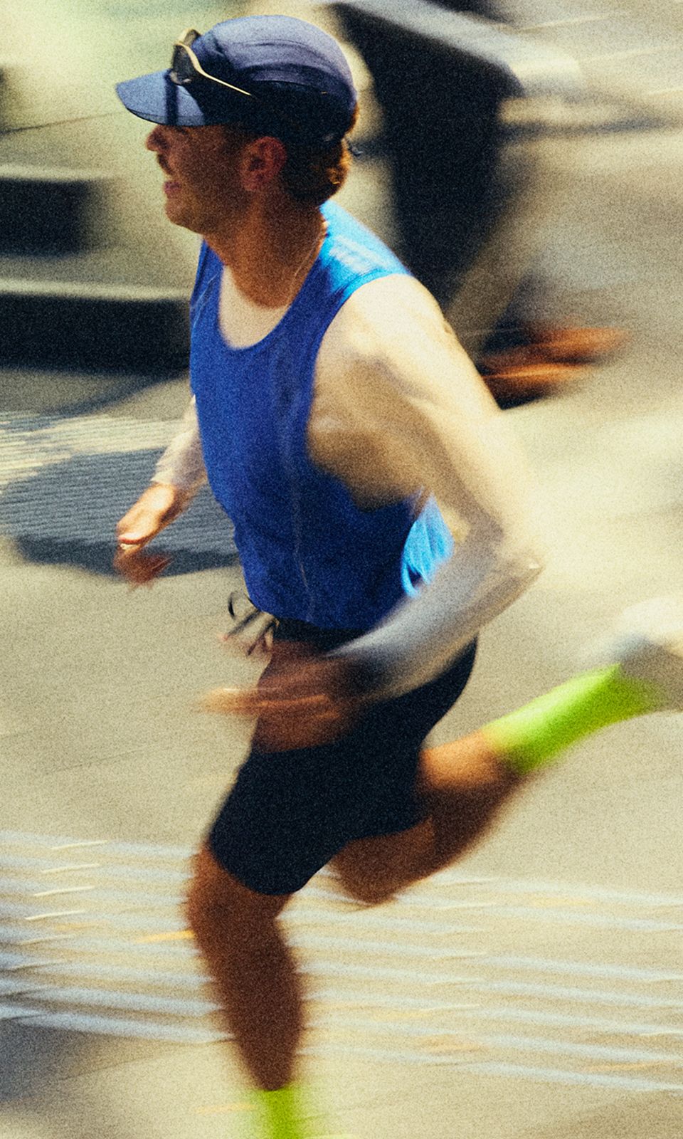 A person wears the lululemon Fast and Free Era Tank, Fast and Free Half Tight, and Split Shift™ Running Shoes while running outdoors. 