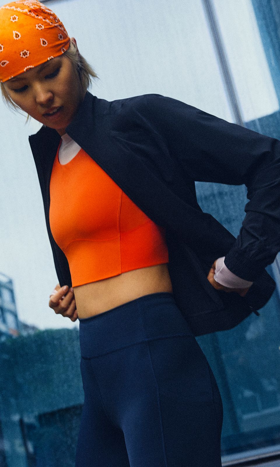 A person wears the lululemon Adapted State Track Jacket. 