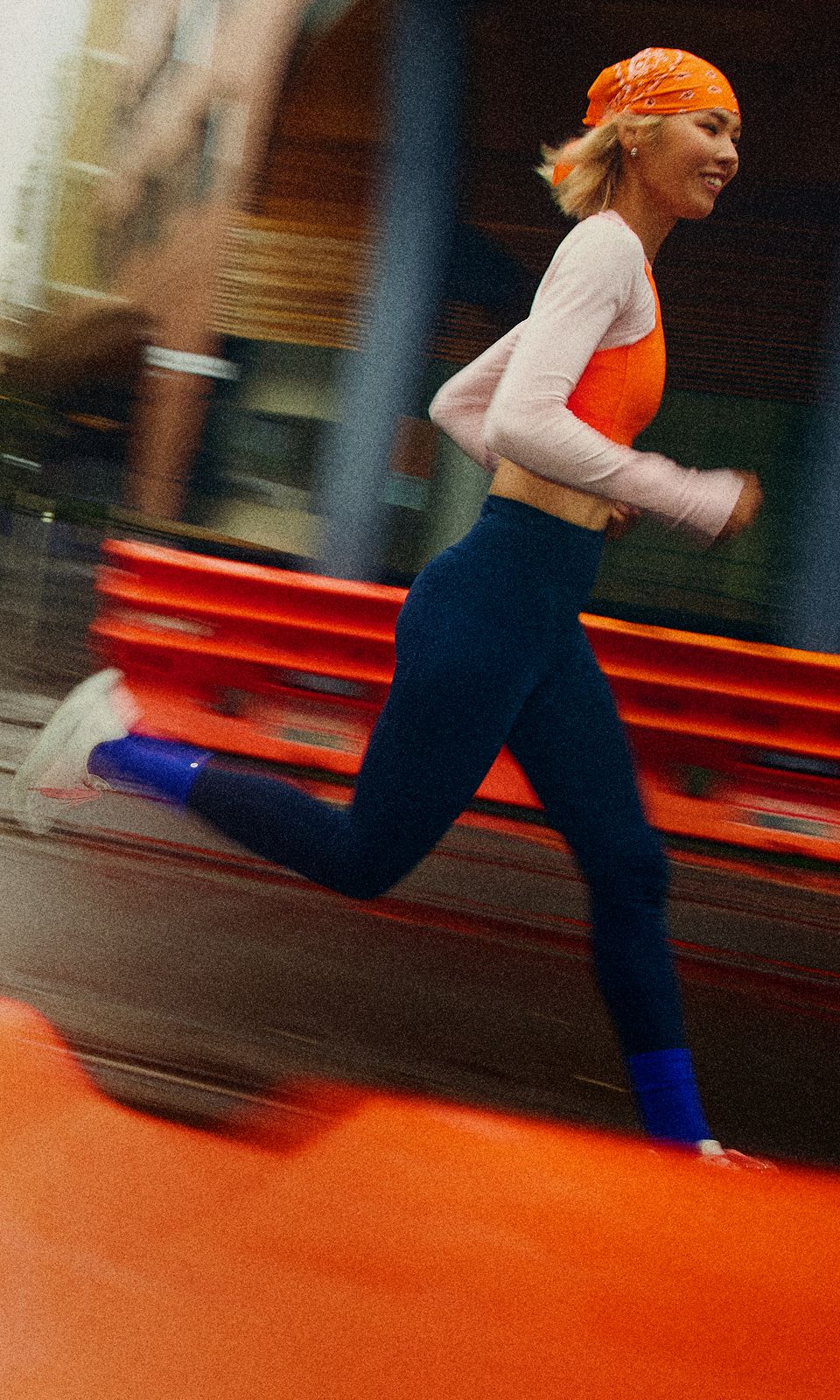 A person wears the lululemon Fast and Free™ High-Rise Tight, Swiftly Tech Long-Sleeve Shirt, and Split Shift Running Shoes while running outdoors. 