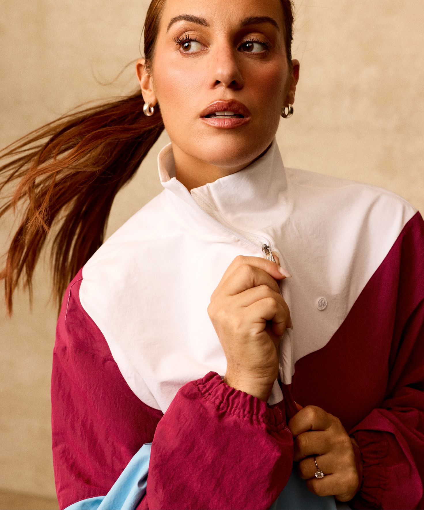 Former D1 Tennis Player, Comedian, and lululemon Ambassador Hannah Berner wears the Half-Zip Tennis Pullover. 