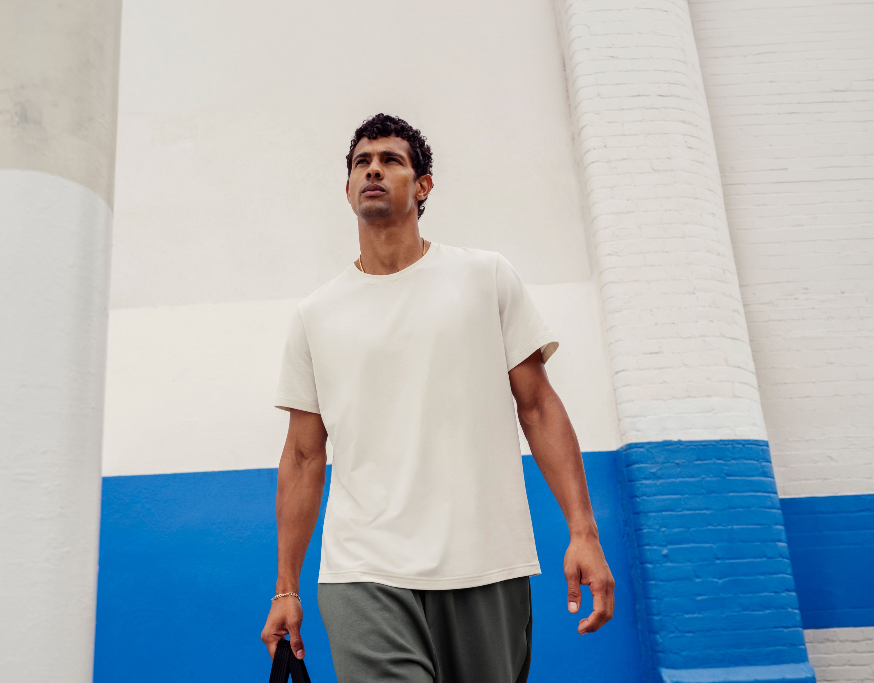 A person poses outdoors in the Everyday Cotton-Blend T-Shirt.