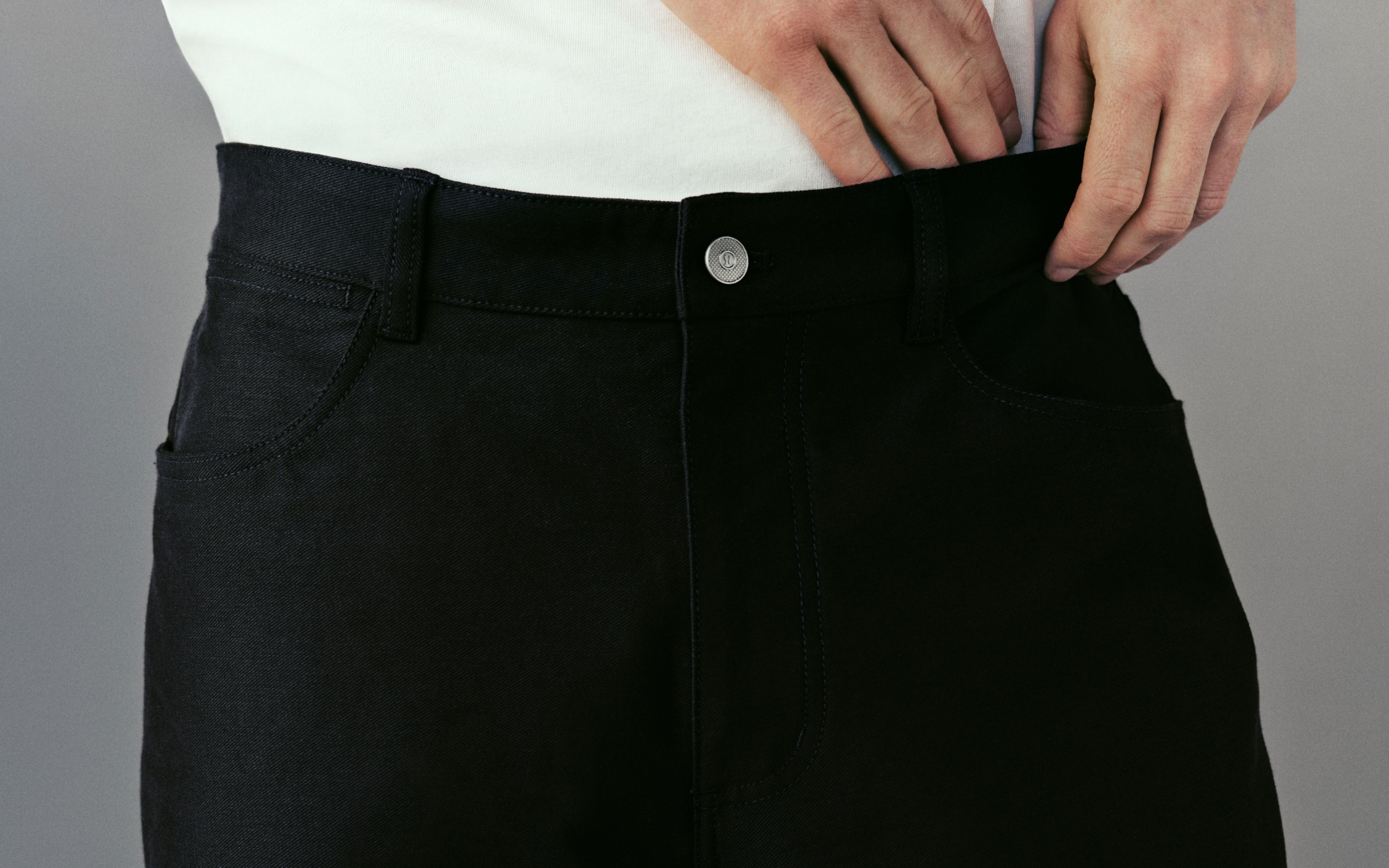 A person wears the EasyFive Loose Straight Pant 34L. On image text reads: "EasyFive: the new standard."