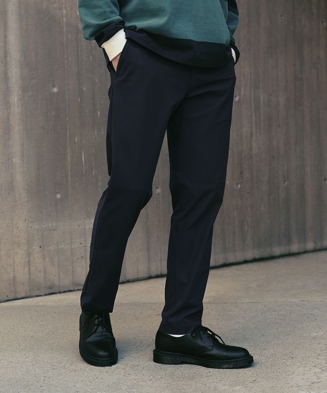 A person wears the Long Sleeve Cotton Rugby Shirt and ABC Classic Fit Trouser.