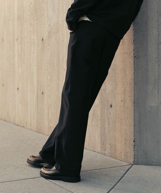 A person wears the EasyFive Loose Straight Pant 34L, Utilitech Twill Chore Coat, and Heavyweight Cotton Jersey T-Shirt.