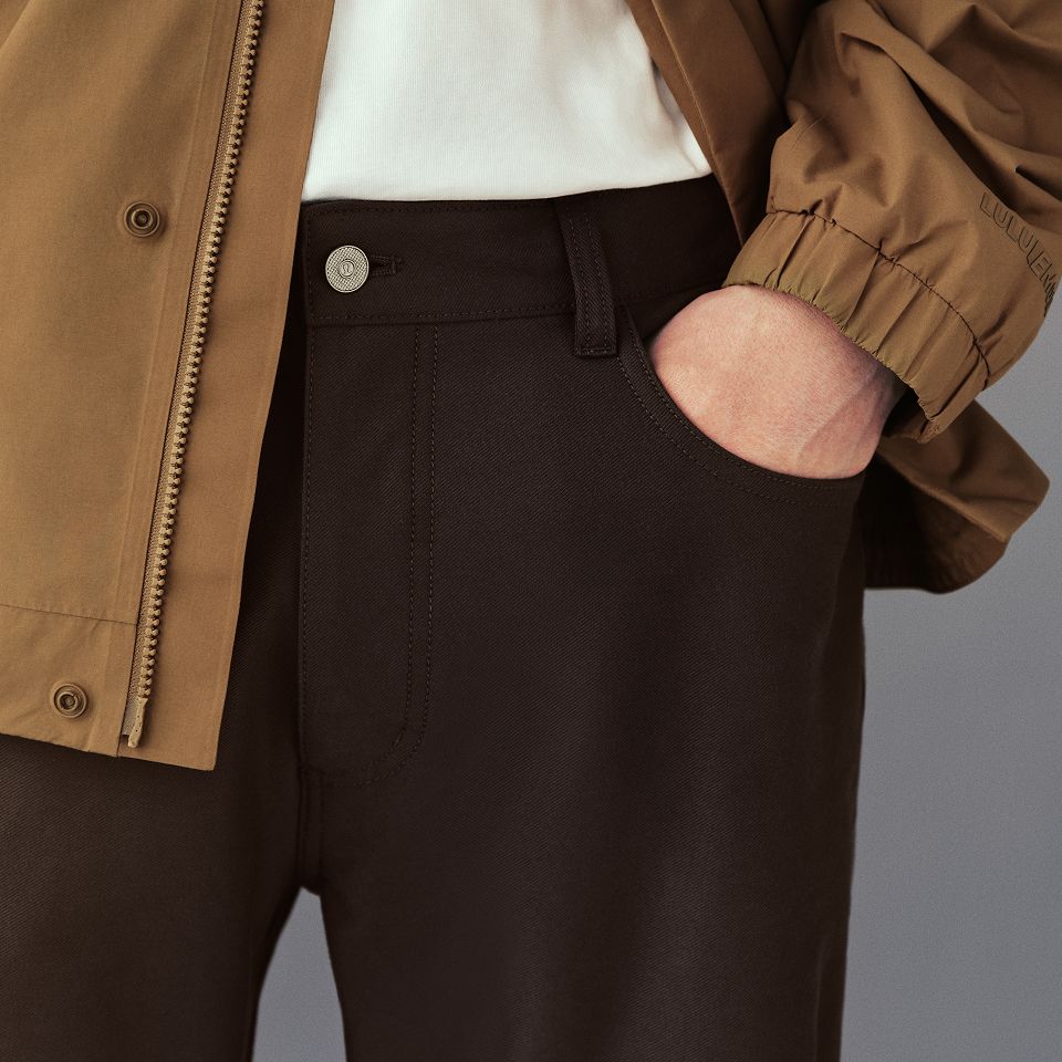 A person wears the EasyFive Loose Straight Pant 34L, Utilitech Twill Chore Coat, and Heavyweight Cotton Jersey T-Shirt.