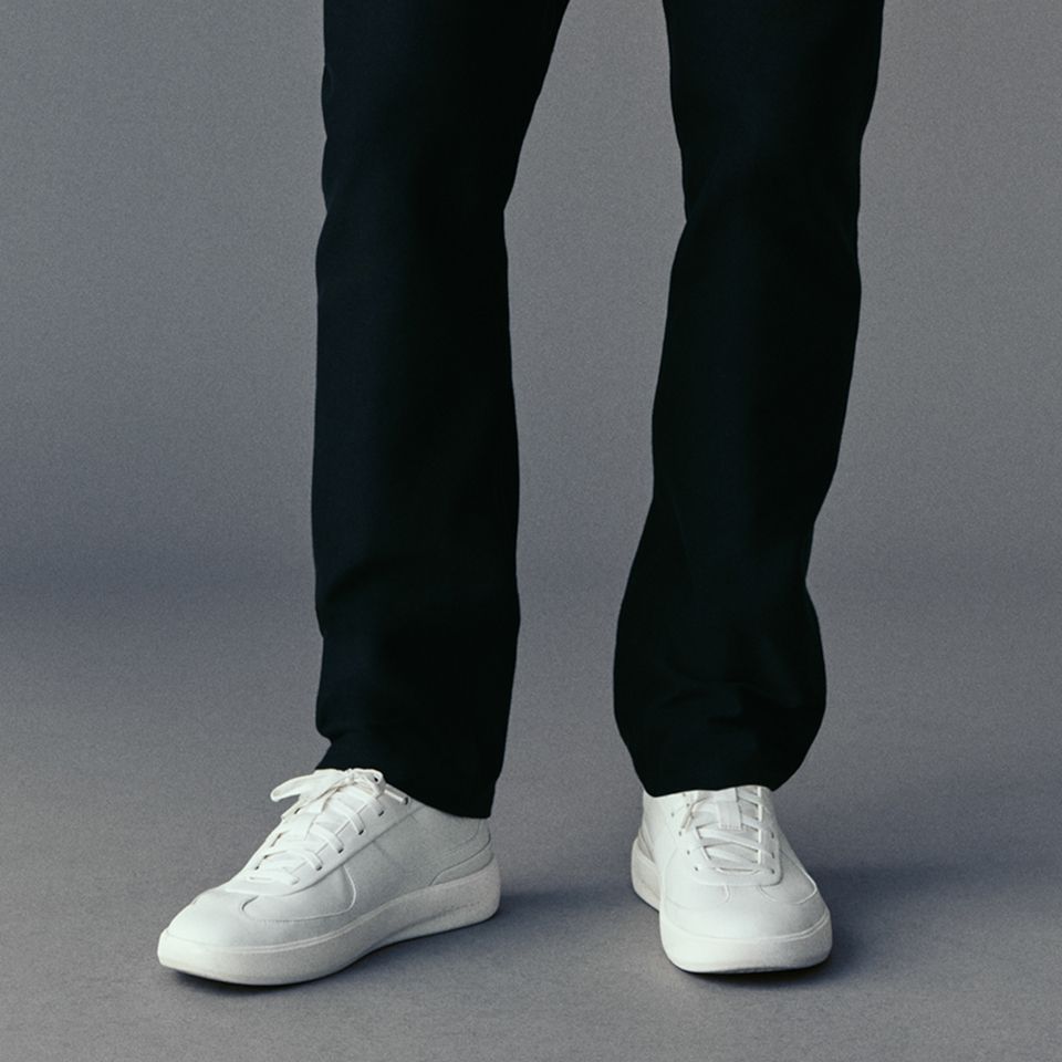 A person wears the EasyFive Slim Pant.