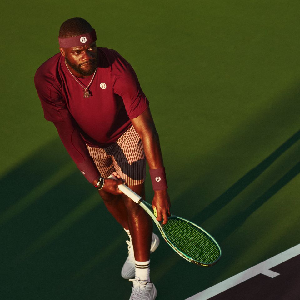 A person in lululemon clothes plays tennis.