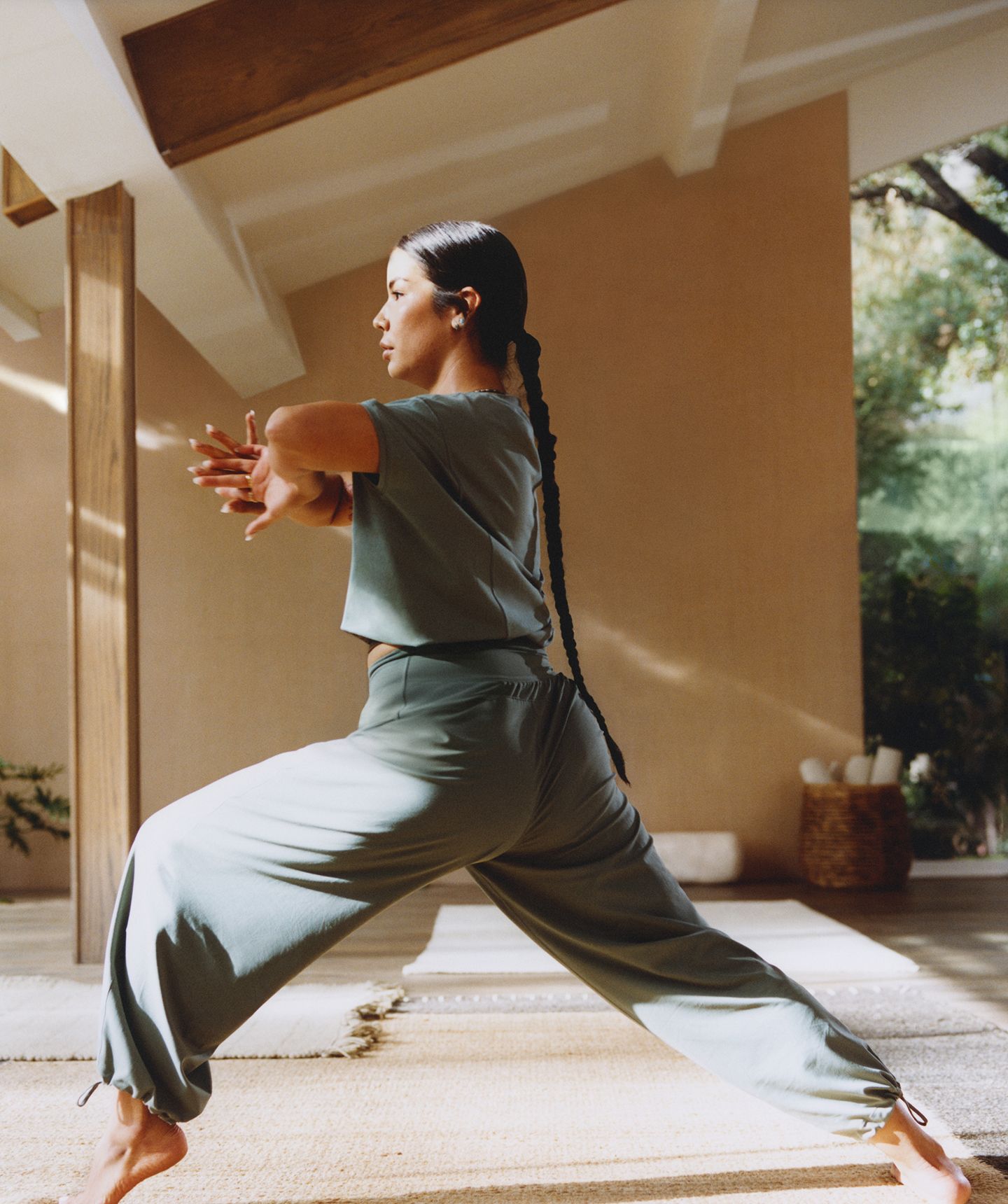 A person wearing lululemon clothes holds a yoga pose.