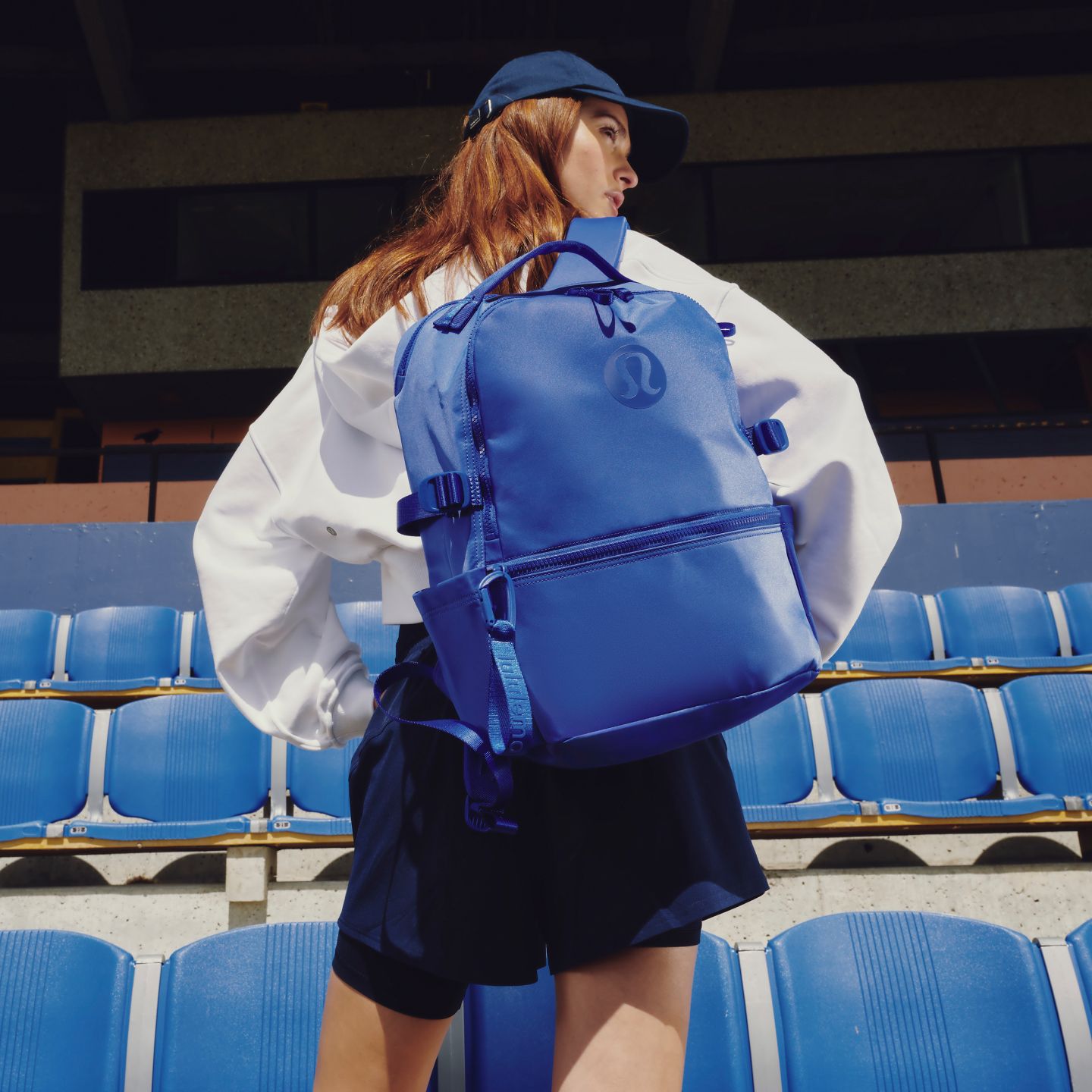 A person wears the lululemon New Crew Backpack 22L.