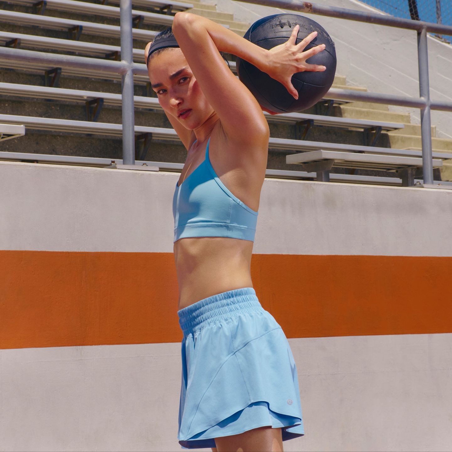 A person is wearing the Flow Y Bra and Shake It Out Short.