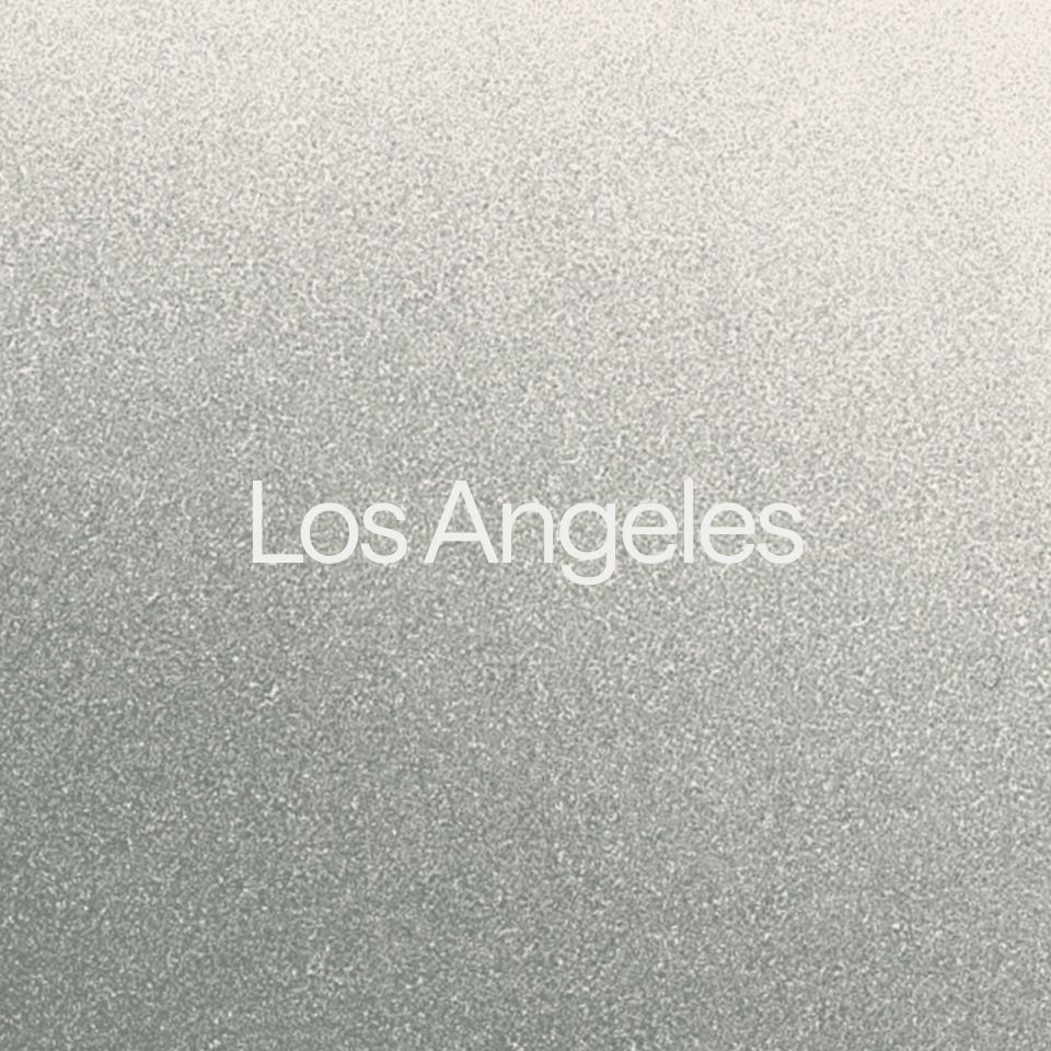 Abstract graphic with a grey gradient. A text overlay reads: "Los Angeles."