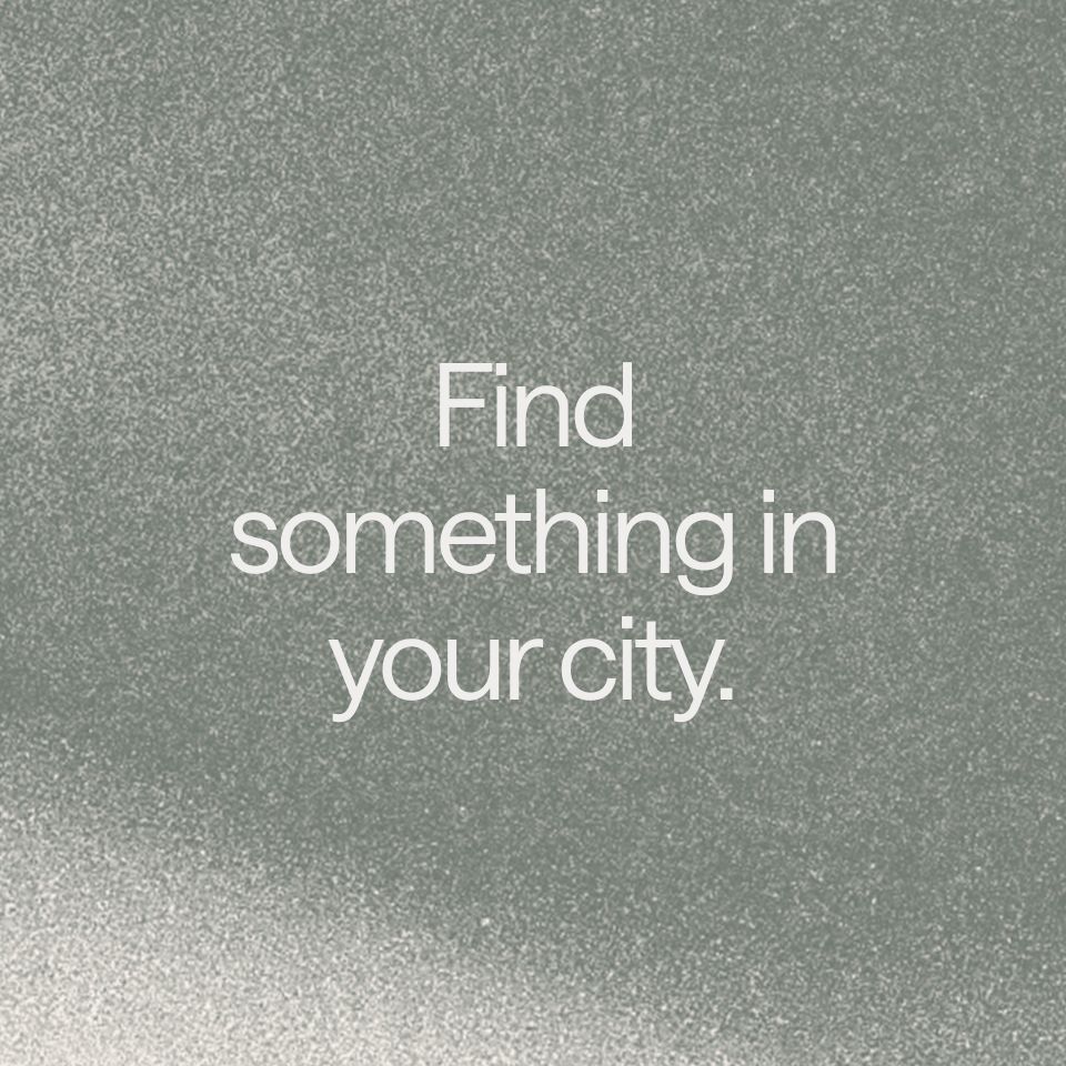 Abstract graphic with a grey gradient. A text overlay reads: "Find something in your city."