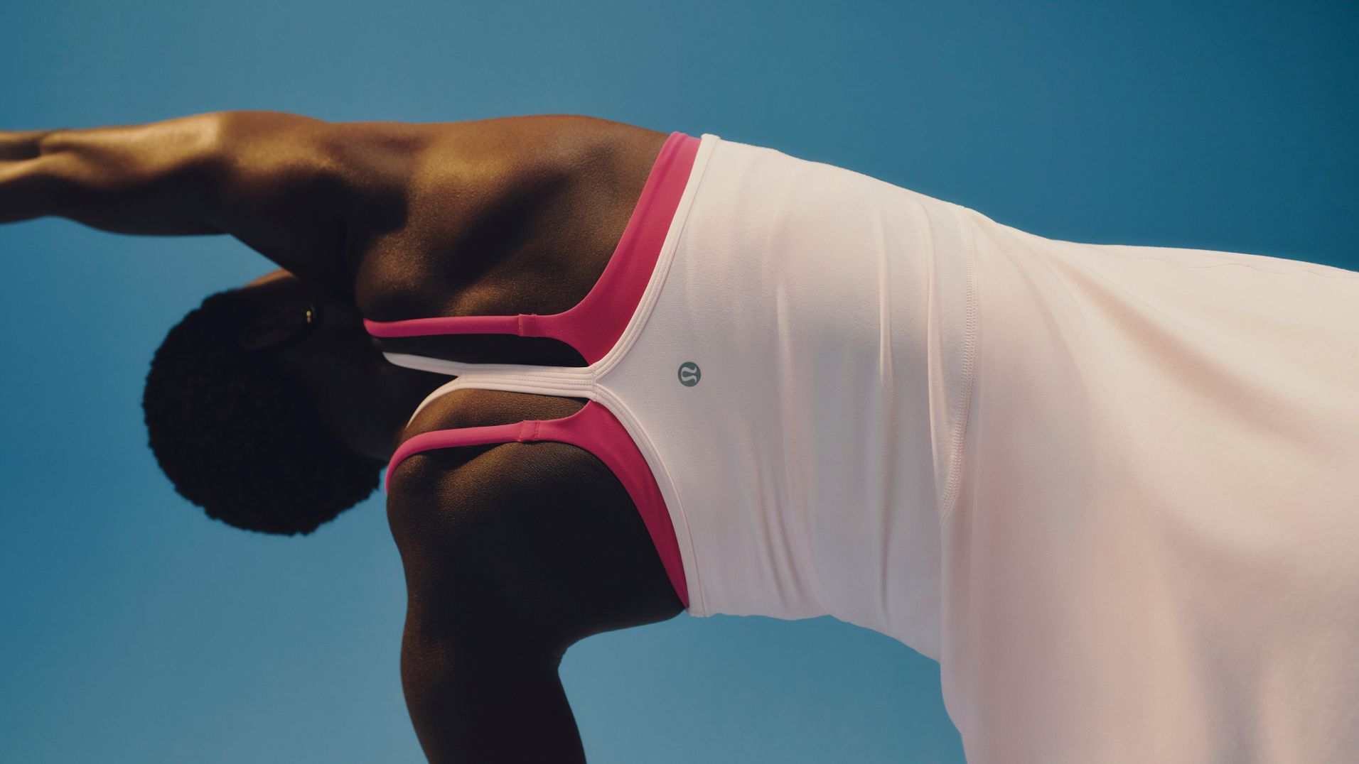 A person is wearing the Flow Y Dress and Wunder Train Strappy Racer Bra.