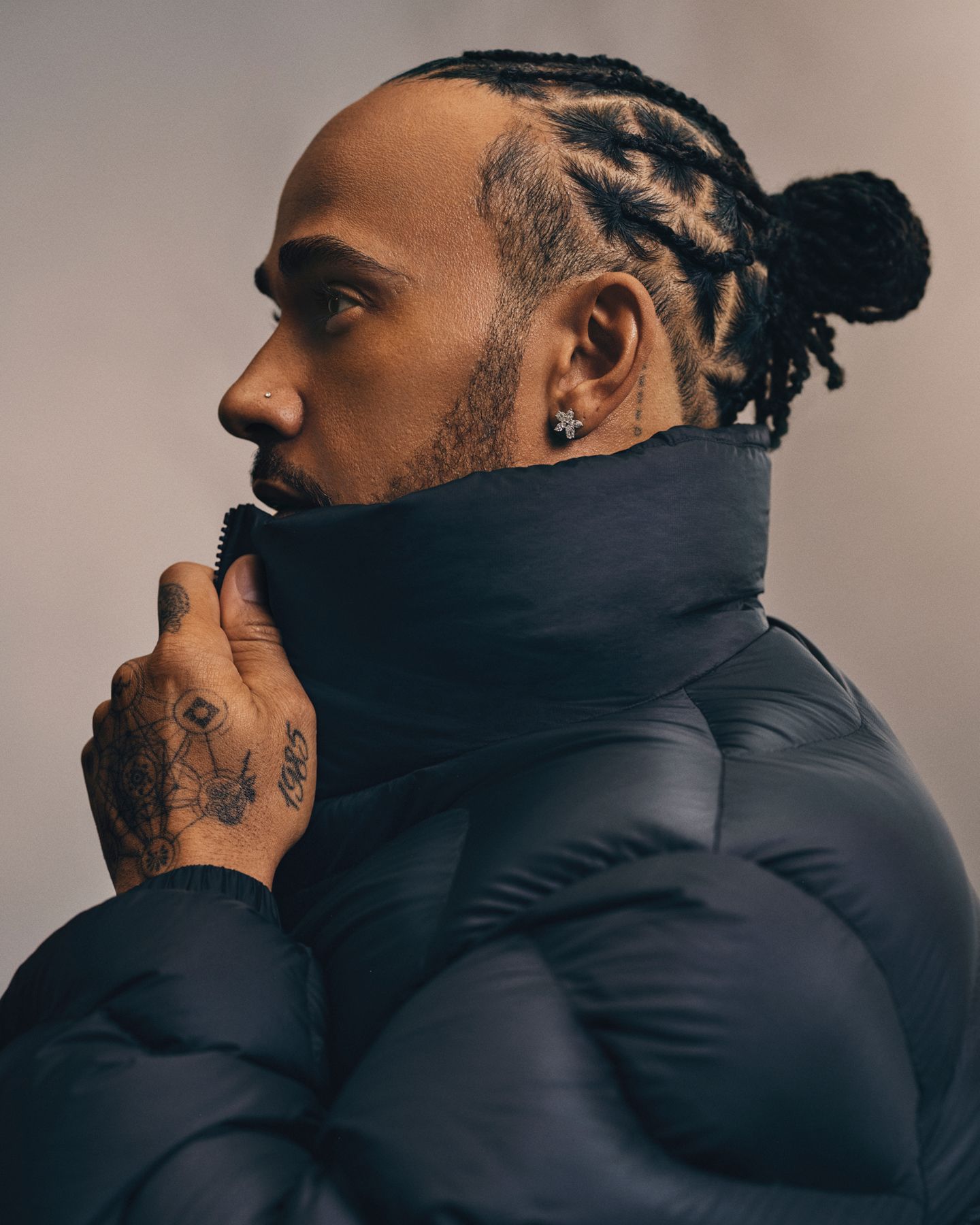 A side view of a person wearing a Featherweight jacket. 