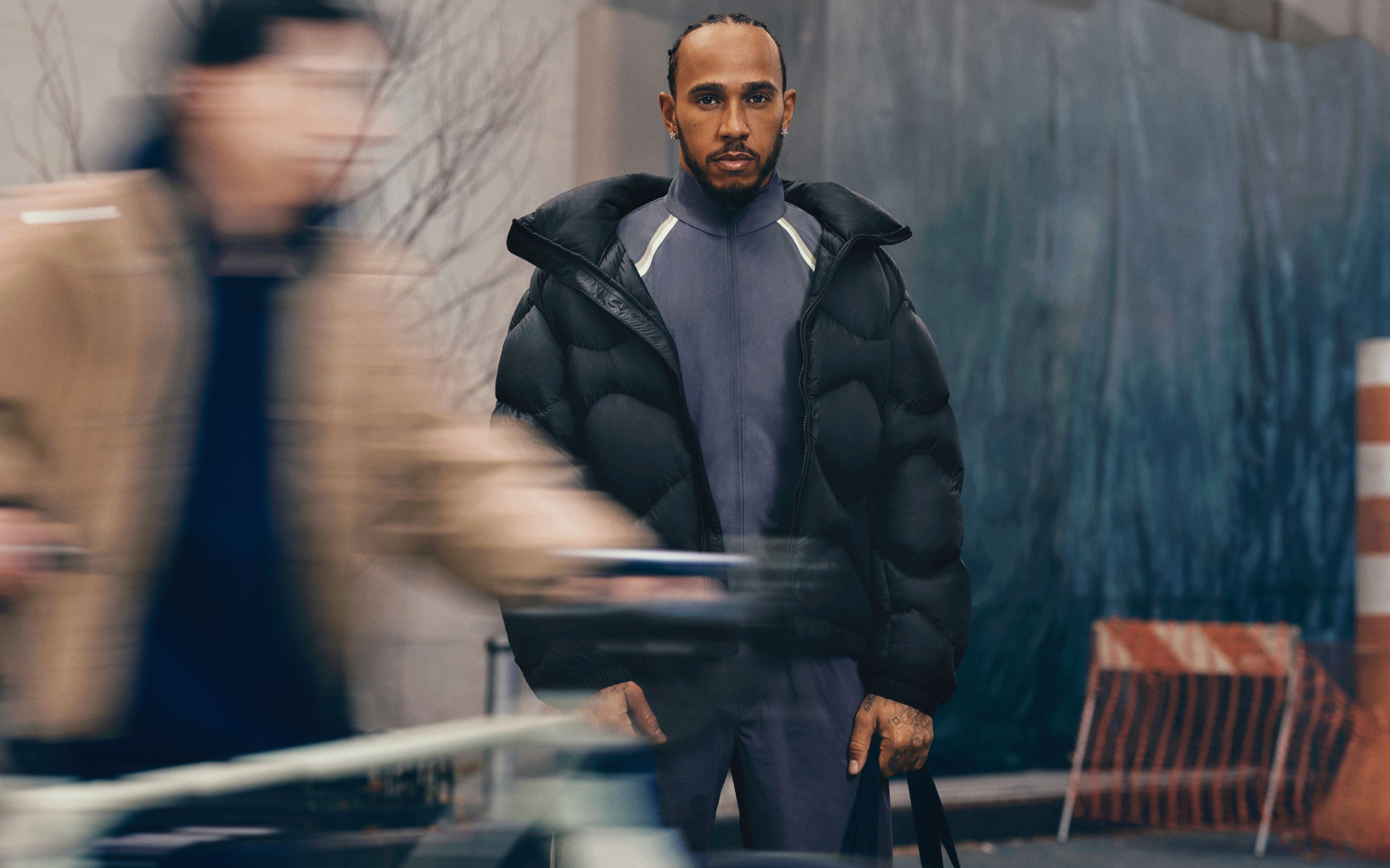 A person wearing a Featherweight jacket on a busy city street. 